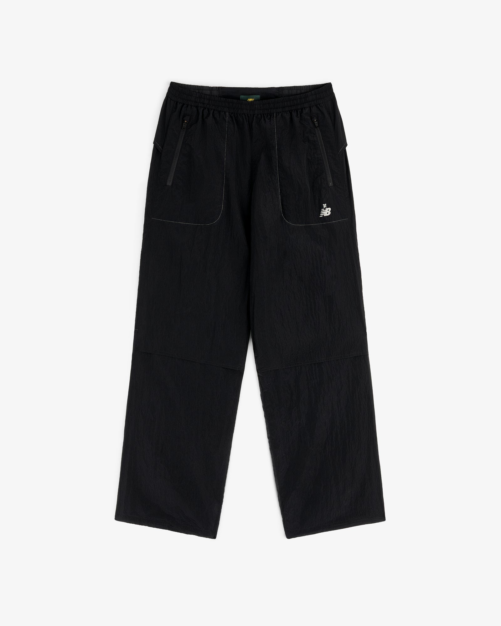 ALD / New Balance Lightweight Nylon Warmup Pant: black, straight-leg, elastic waist, front pockets, white logo.