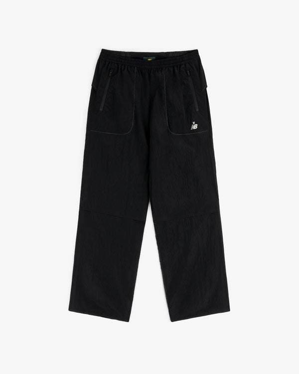 ALD / New Balance Lightweight Nylon Warmup Pant: black, straight-leg, elastic waist, front pockets, white logo.