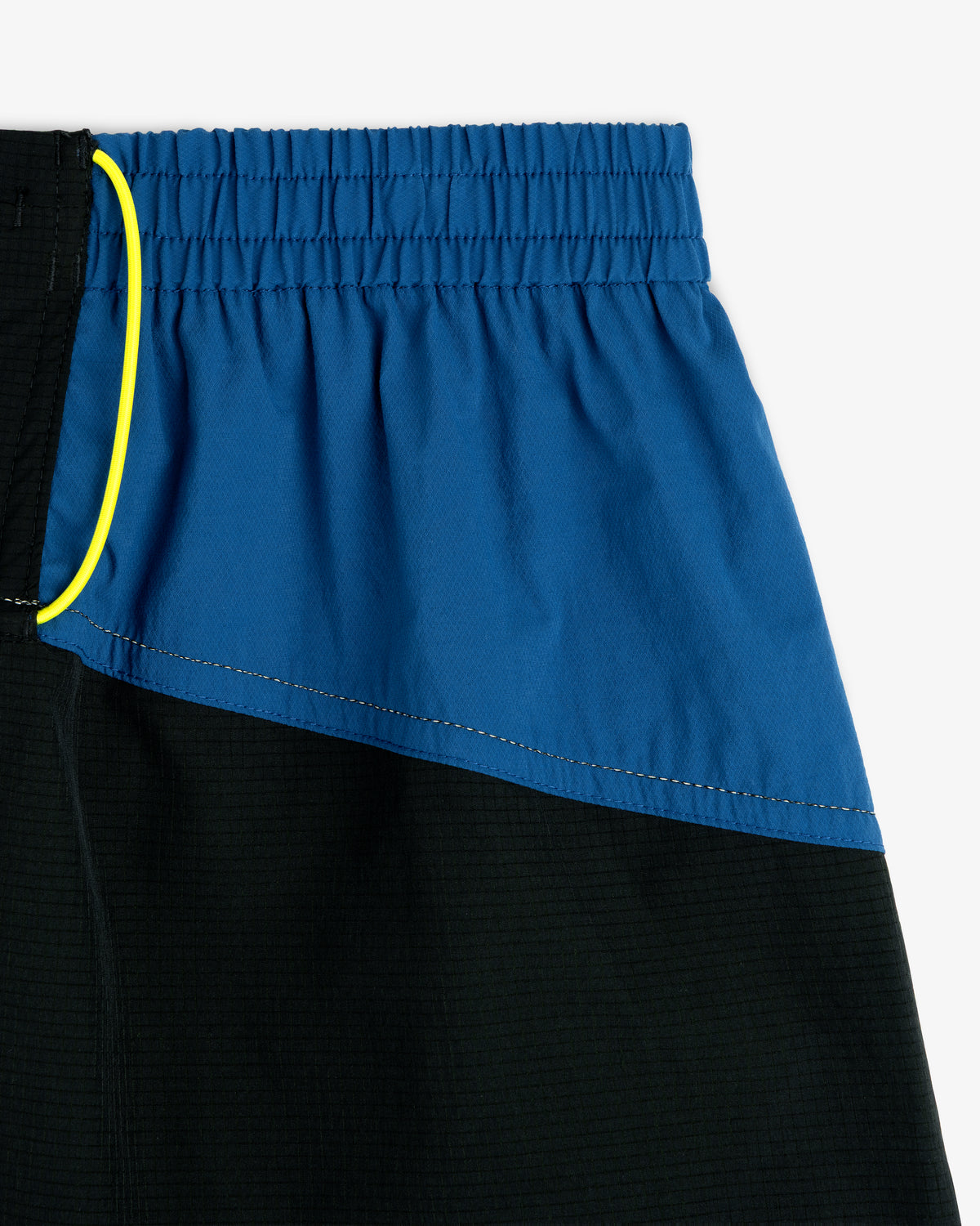 Close-up of ALD / New Balance Performance Lightweight Running Short in blue and black with yellow drawstring.