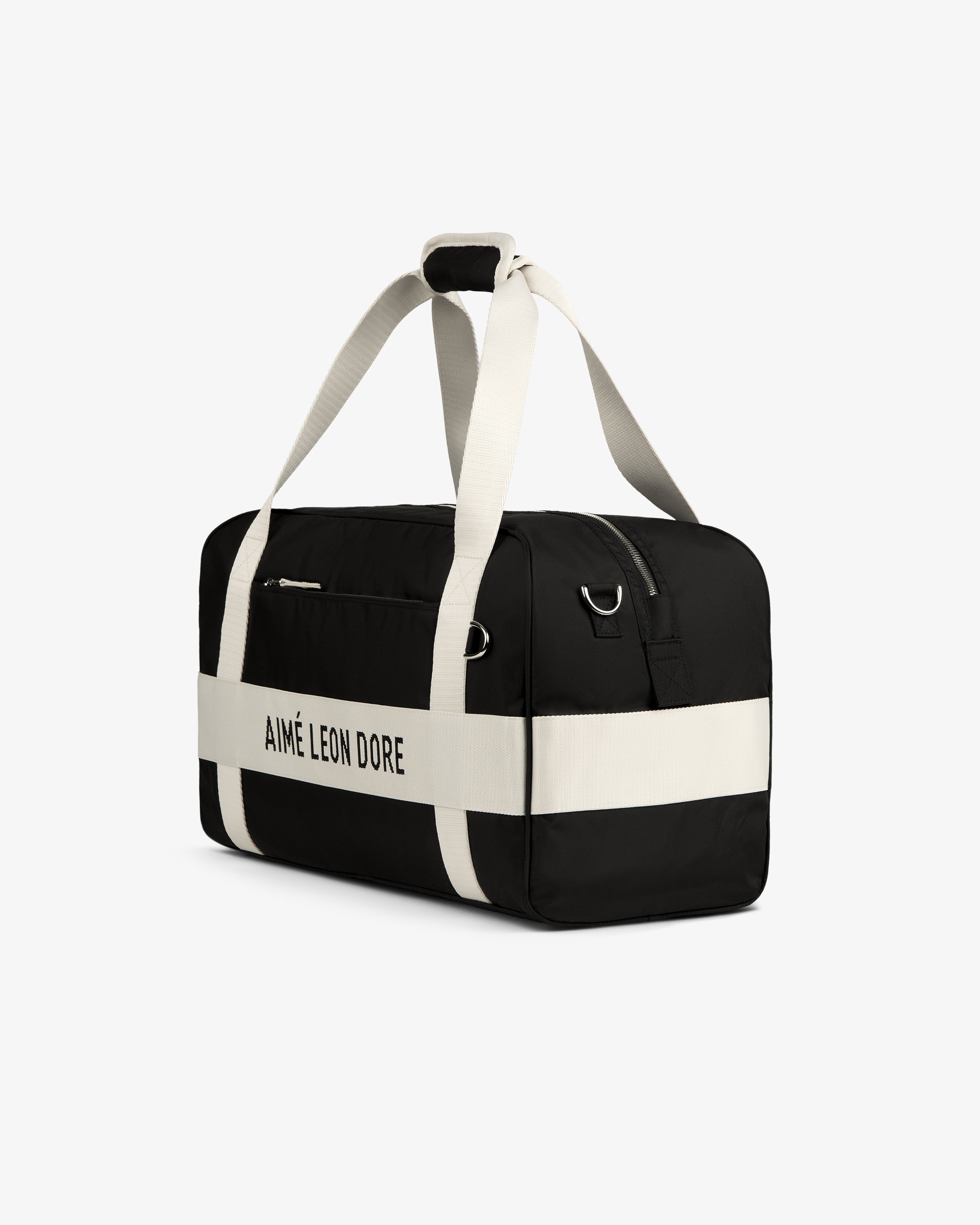 Black Nylon Duffle Bag by Aimé Leon Dore with white straps and logo, displayed on a white background.