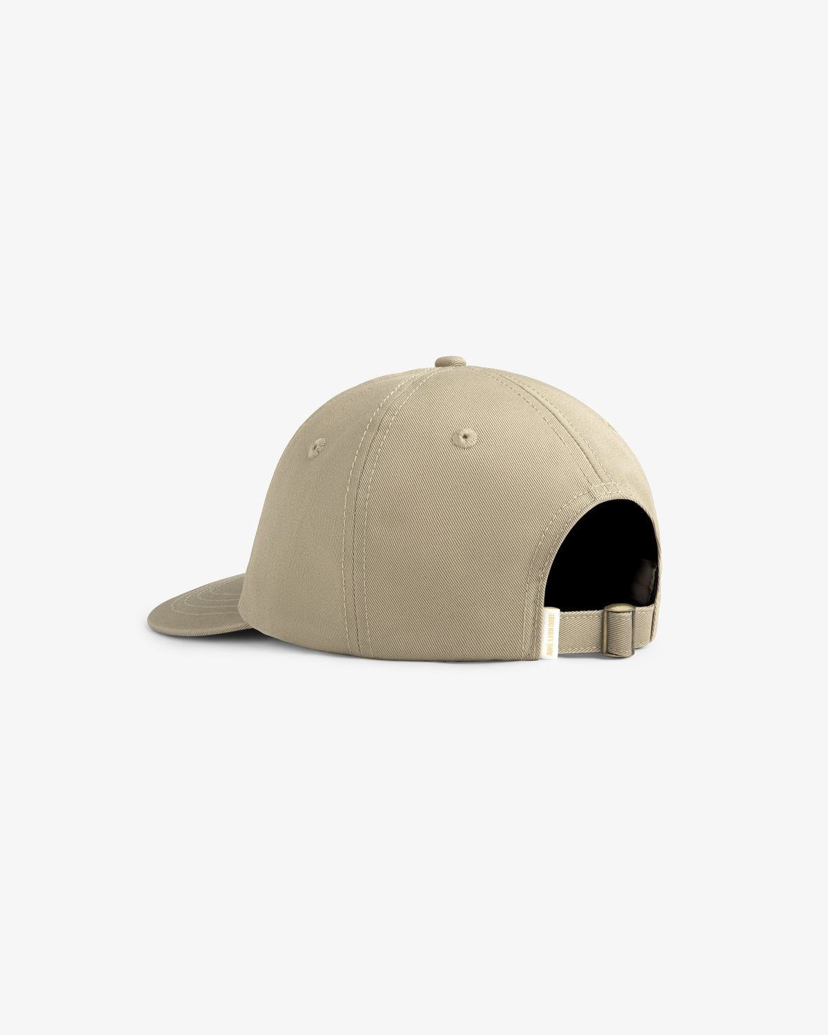 The Core Logo Hat in beige is shown from the back, featuring an adjustable strap and a metal buckle.