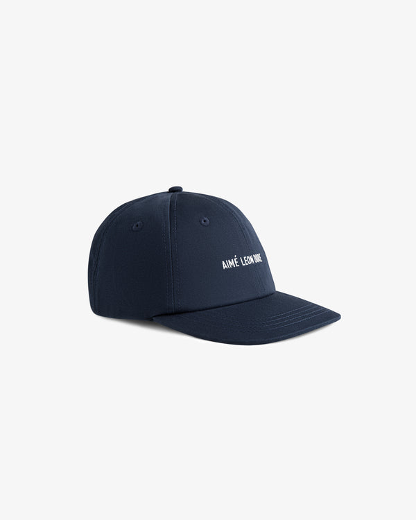 Core Logo Hat in navy blue with white AIMÉ LEON DORE embroidery on the front.