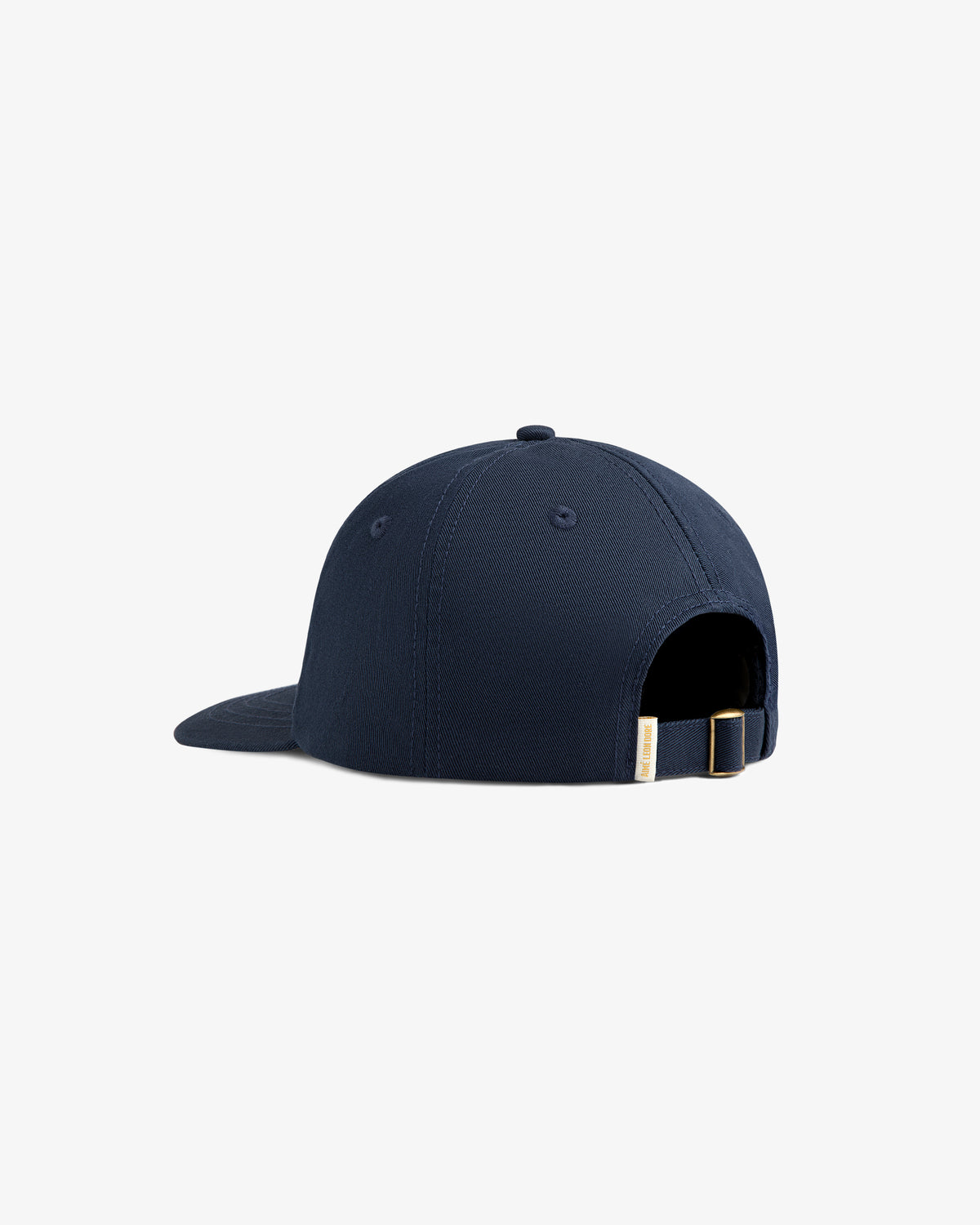 The Core Logo Hat in navy, shown from the back, features an adjustable strap with a metal buckle.