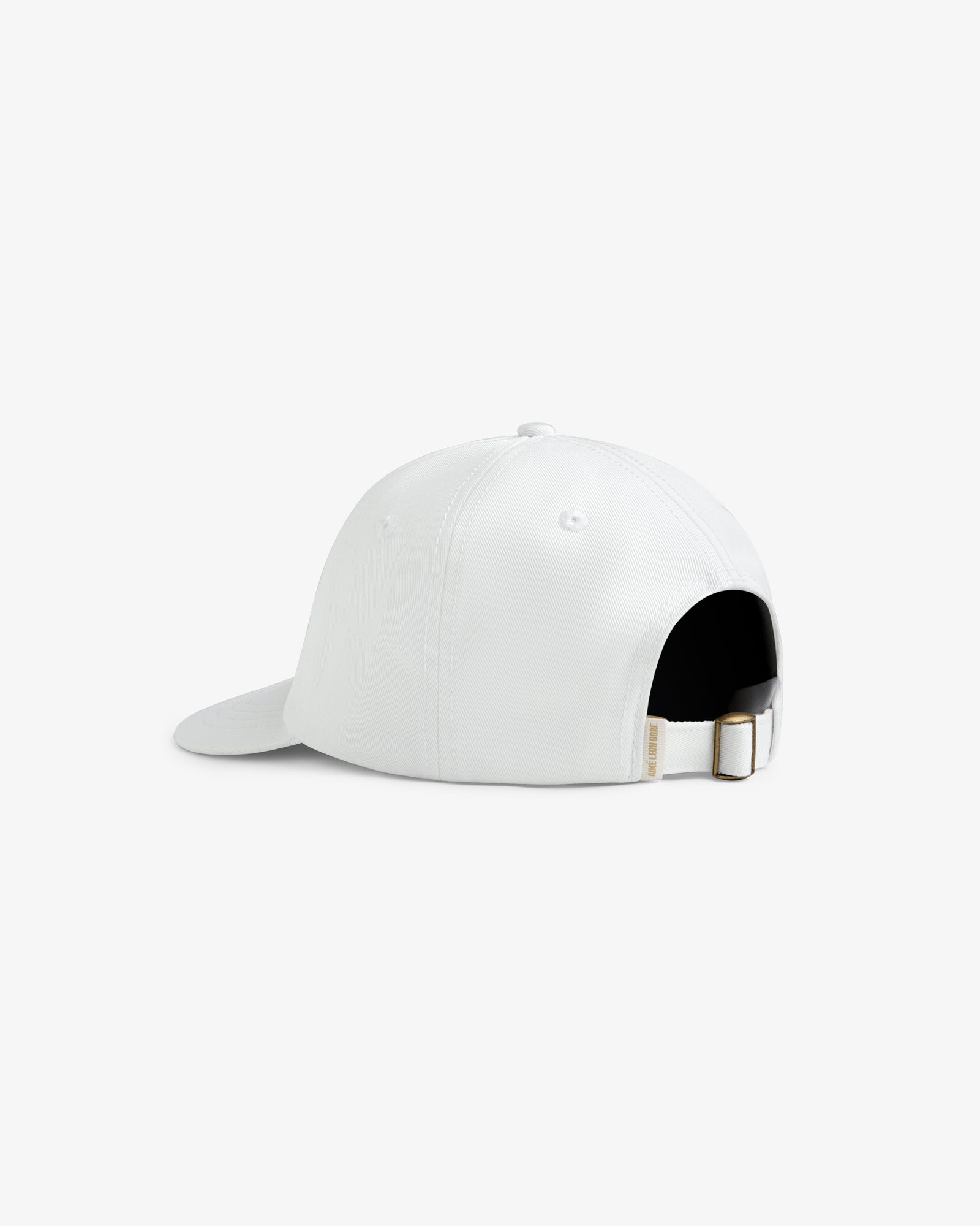 The Core Logo Hat is a white cap shown from the back, featuring an adjustable strap and metal buckle.
