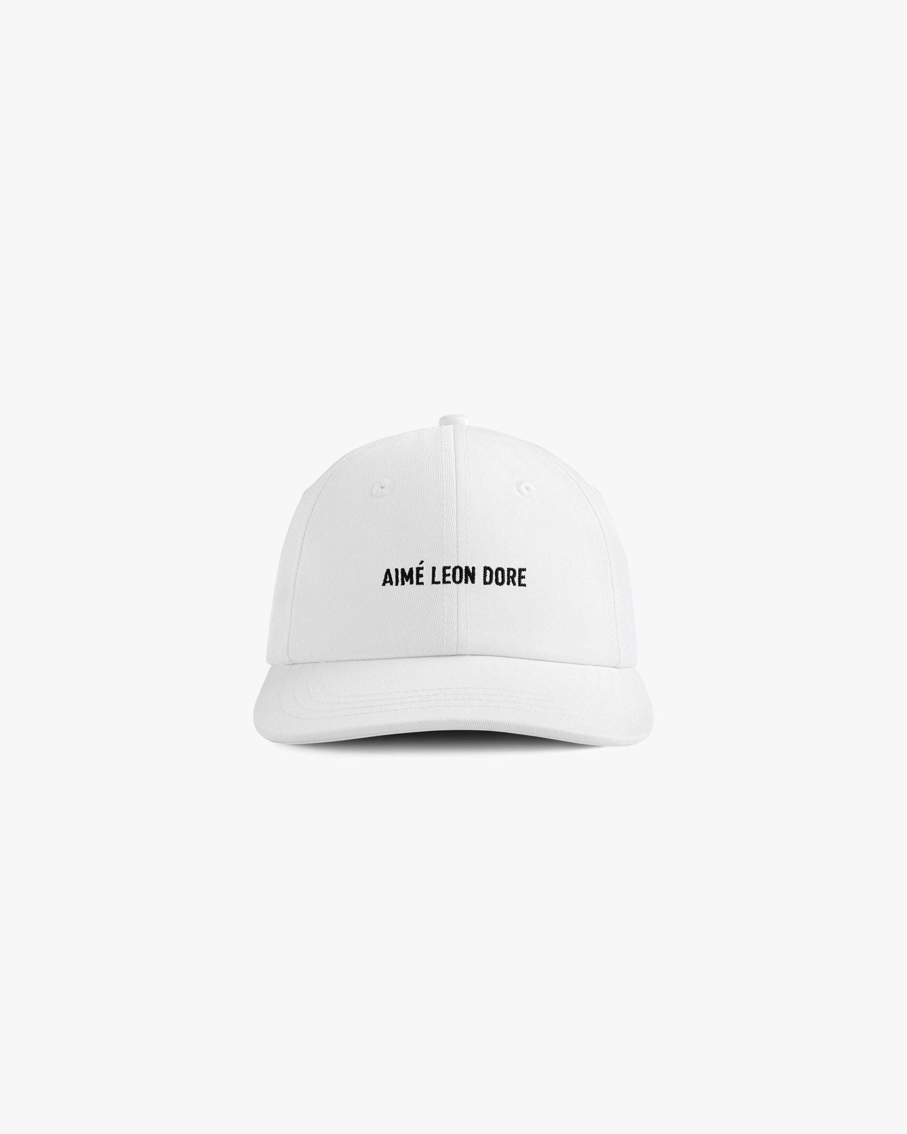 Core Logo Hat: white baseball cap with small black "AIMÉ LEON DORE" text centered on the front.