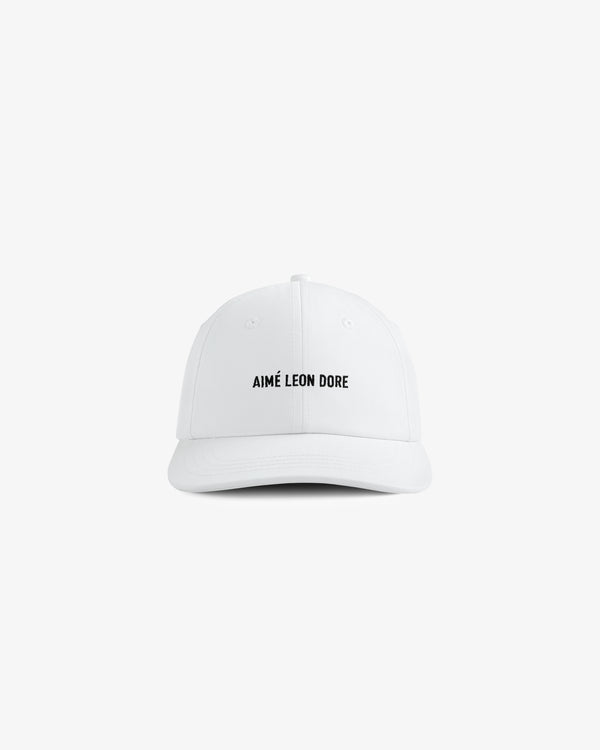 Core Logo Hat: white baseball cap with small black "AIMÉ LEON DORE" text centered on the front.