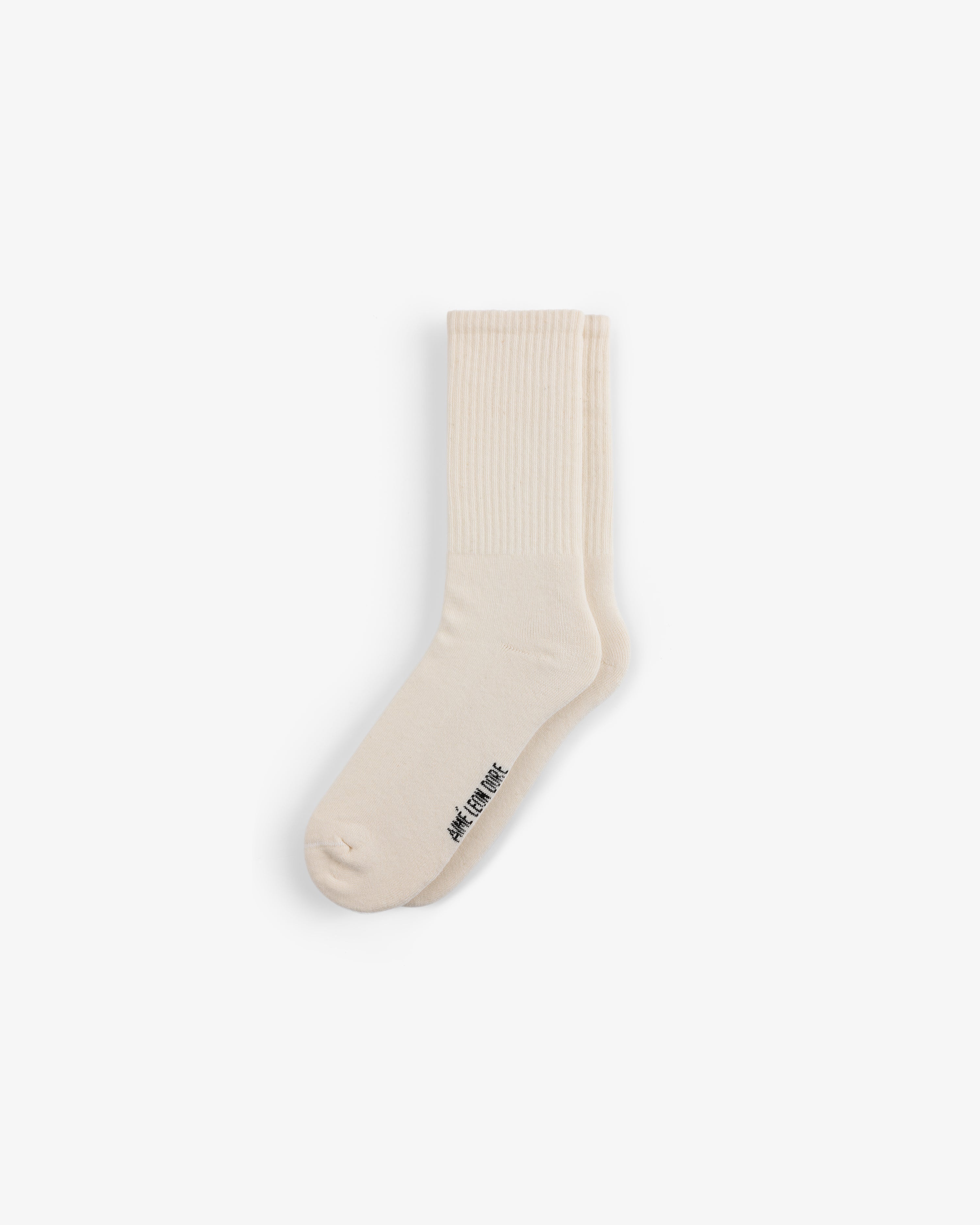 Crew Sock 3-Pack: cream crew socks with ribbed cuffs and small black text near the toe on a white background.
