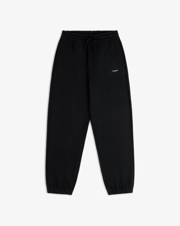 Micro Logo Sweatpants: black, elastic waist, drawstring, cuffed ankles, small white logo on left thigh.
