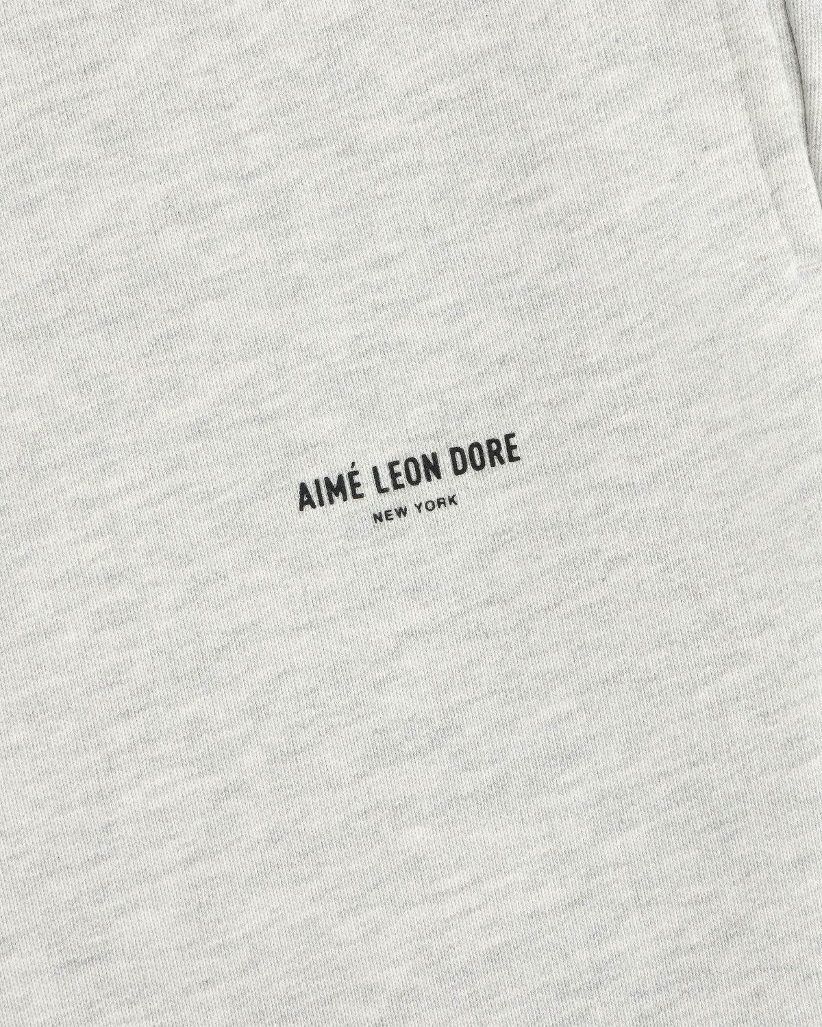 Light gray Micro Logo Sweatpants with small black AIMÉ LEON DORE NEW YORK text at the center.