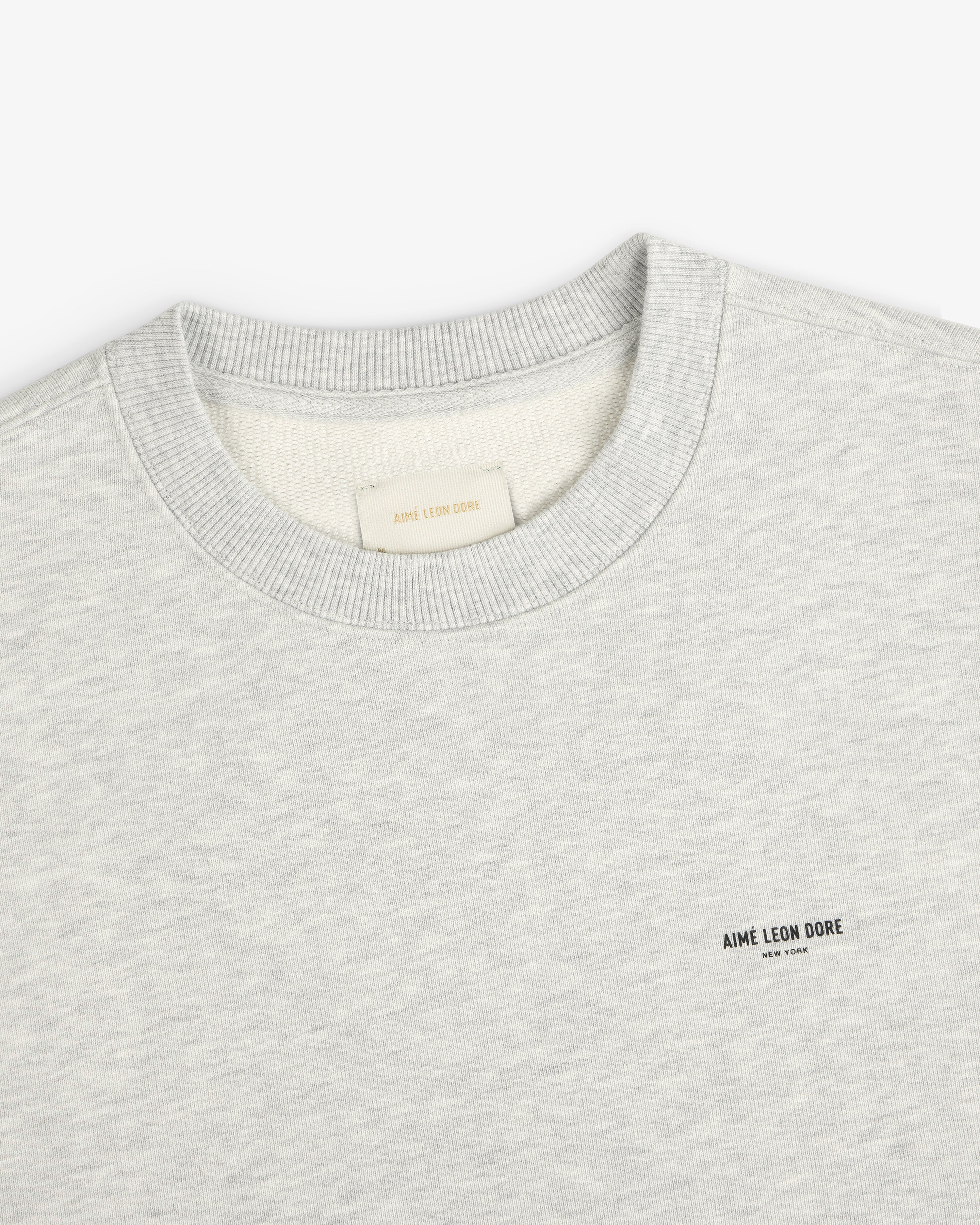 Light gray Micro Logo Crewneck Sweatshirt with small AIME LEON DORE text logo on left chest.
