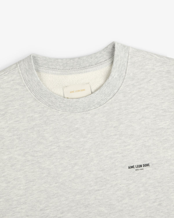 Light gray Micro Logo Crewneck Sweatshirt with small AIME LEON DORE text logo on left chest.