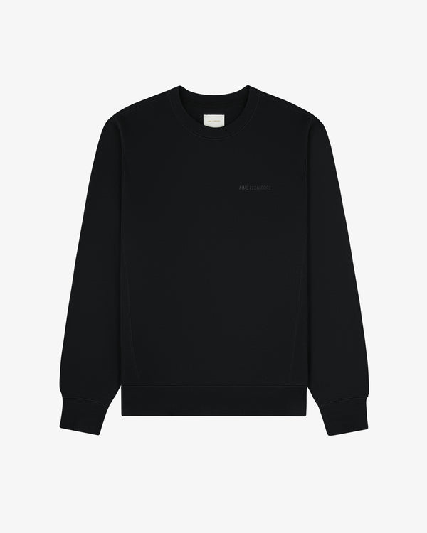 Tonal Logo Crewneck Sweatshirt in plain black with small chest text, shown on a white background.