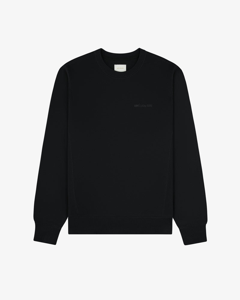 Tonal Logo Crewneck Sweatshirt in plain black with small chest text, shown on a white background.
