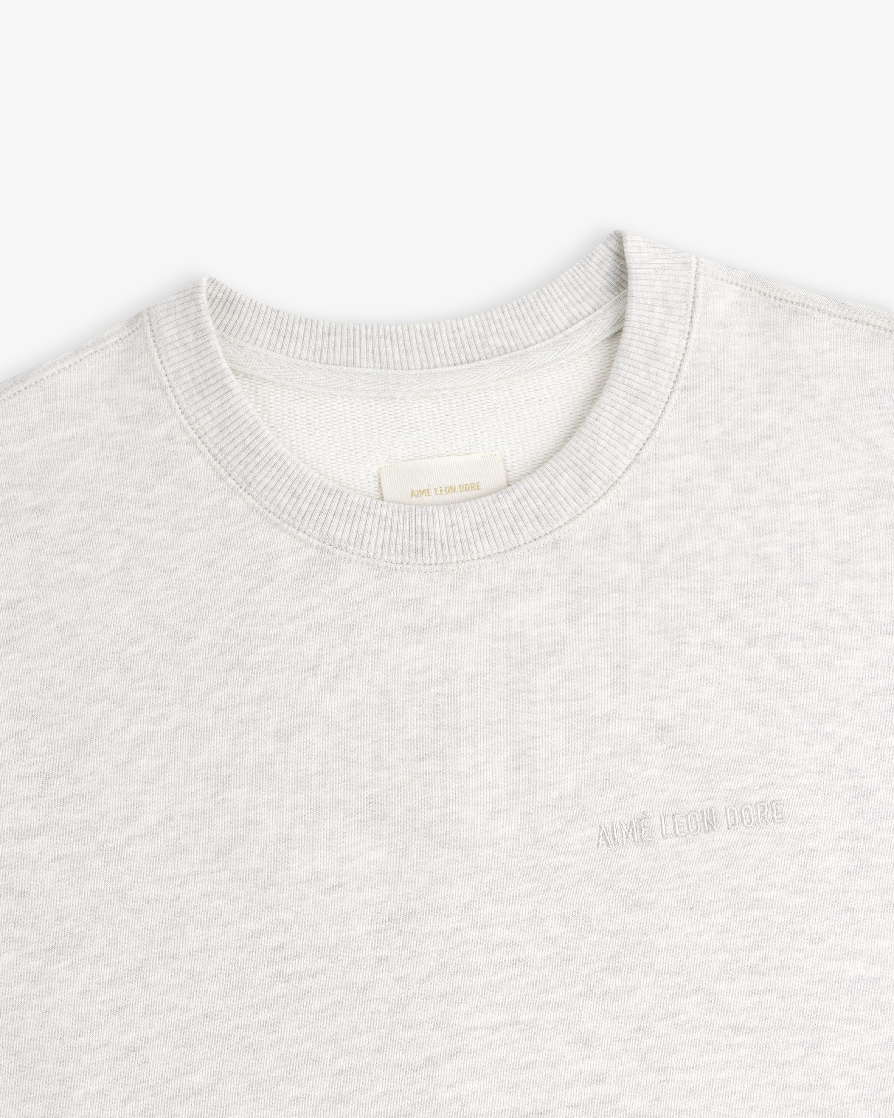 Light gray Tonal Logo Crewneck Sweatshirt with chest embroidery, shown flat on a white background.