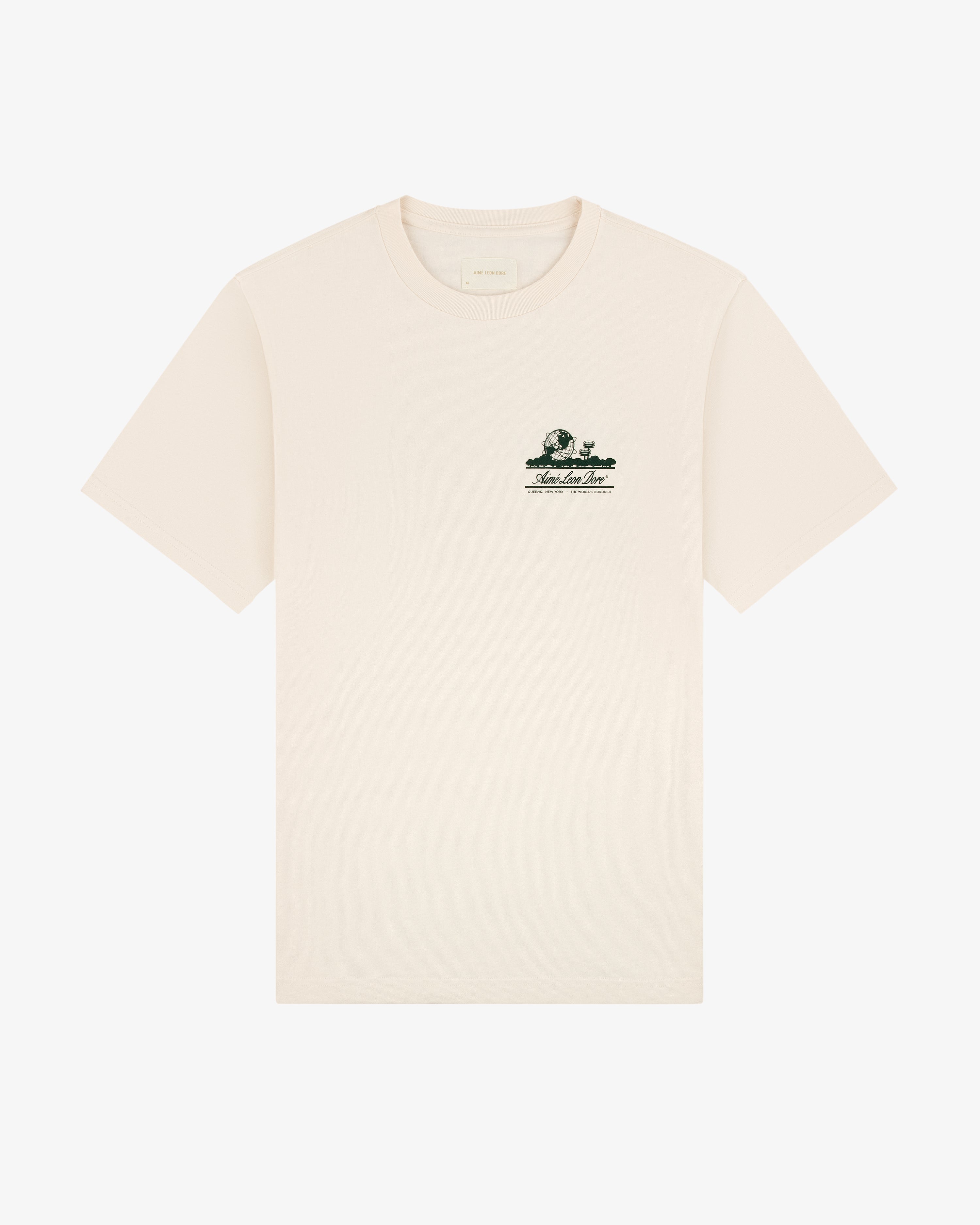Beige Unisphere Tee featuring a small green graphic and text on the left chest.