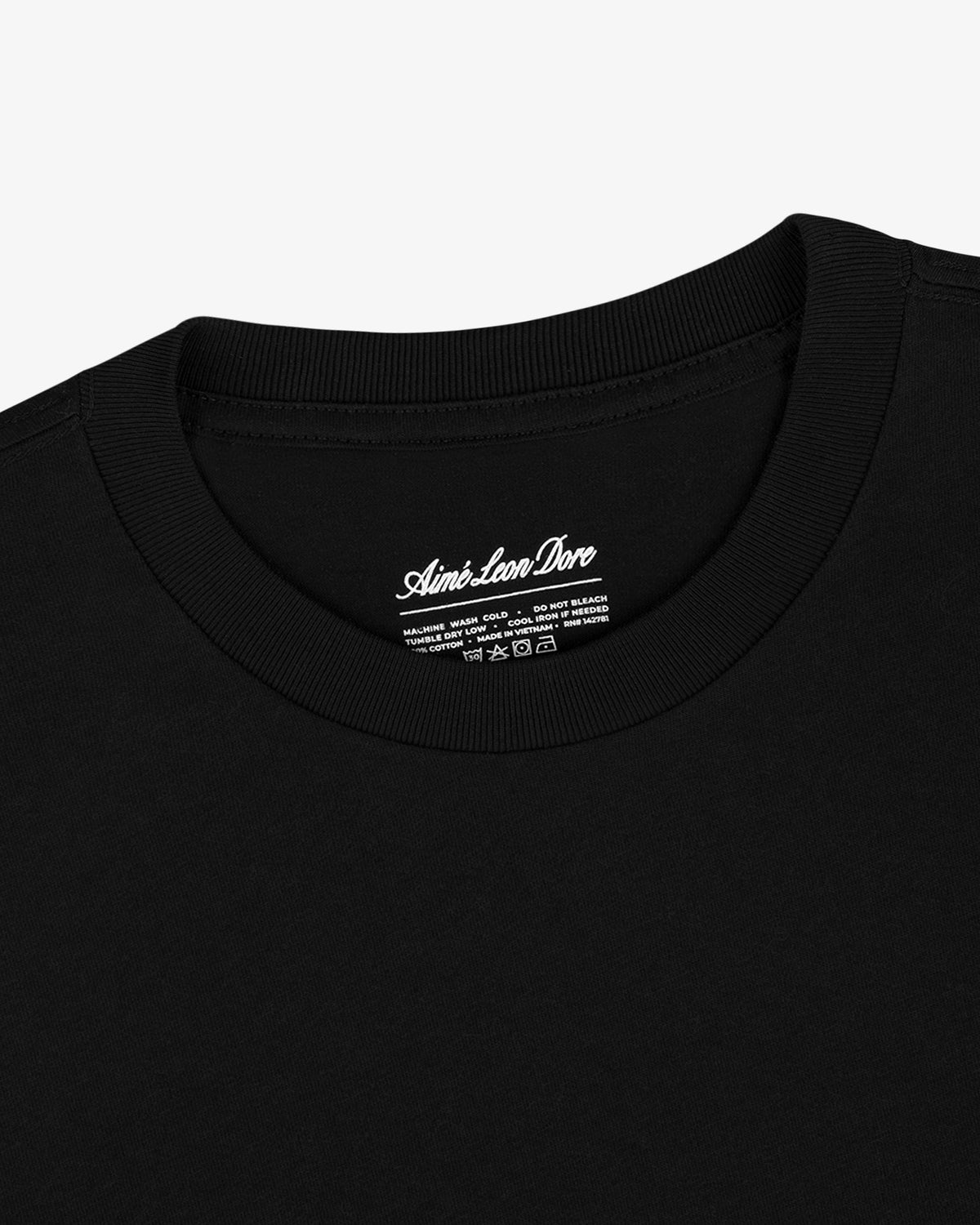 Close-up of a black crew neck from the Multi-Color T-Shirt 3-Pack with branded inner neck label.