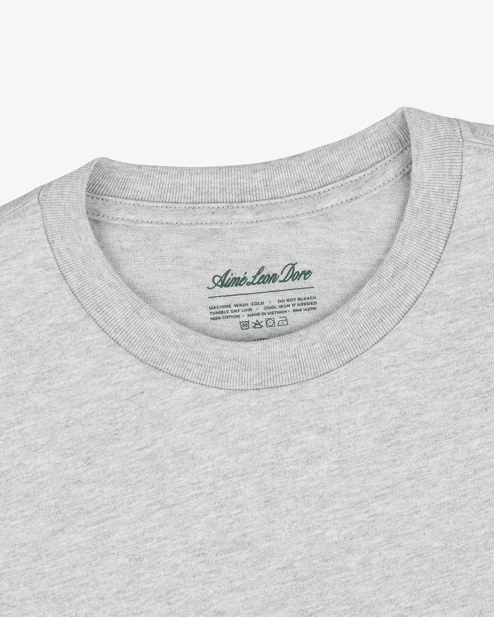 Close-up of a Multi-Color T-Shirt 3-Pack in light gray with Aimé Leon Dore label printed inside the collar.