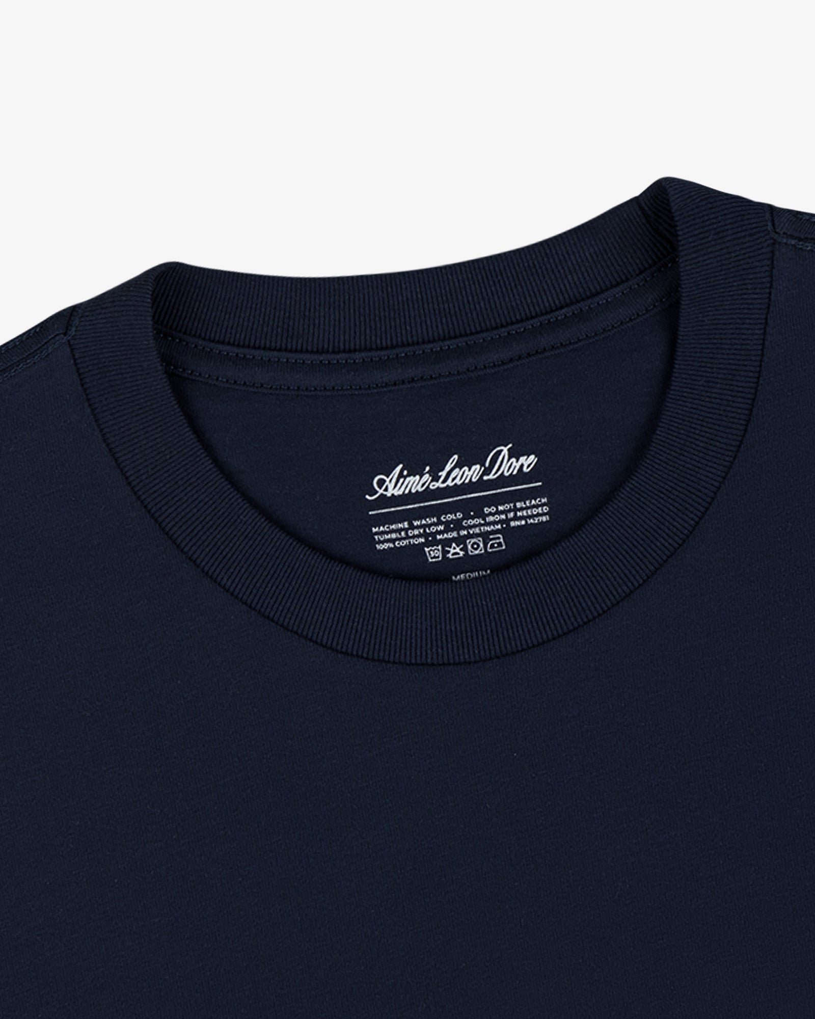 Close-up of a Multi-Color T-Shirt 3-Pack with branding visible on the inside neck label.