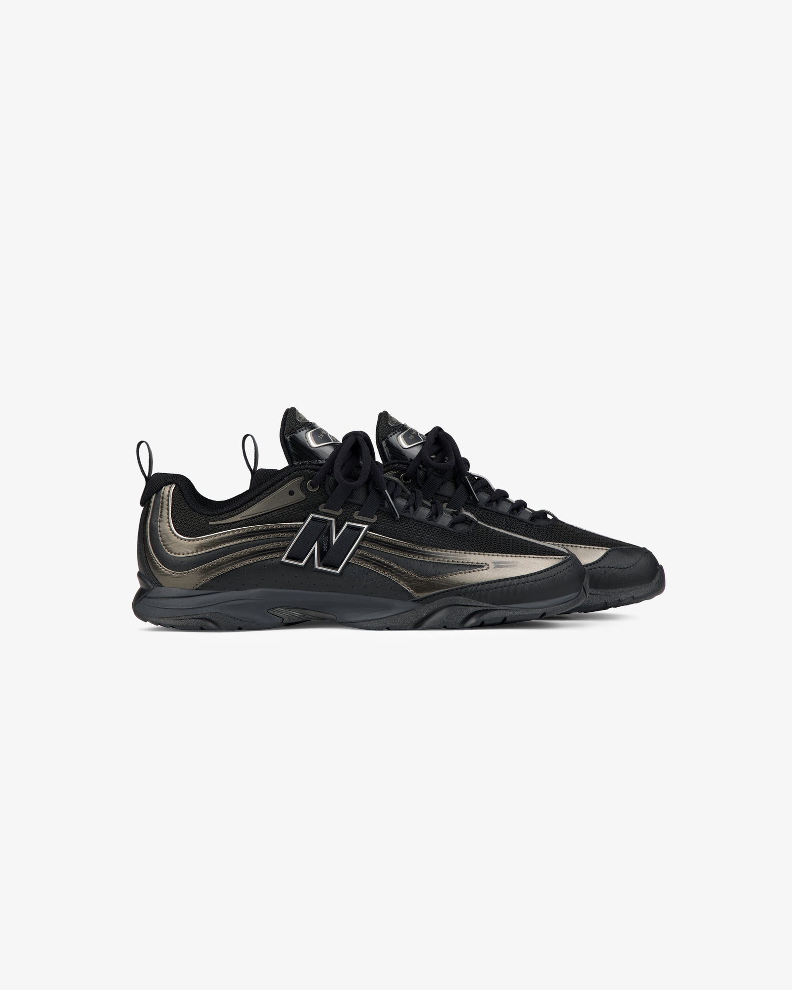 A pair of black and metallic ALD / New Balance RC56 sneakers with black soles, laces, and a bold side logo on white.