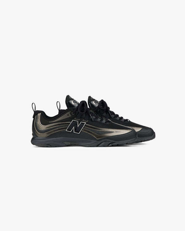 A pair of black and metallic ALD / New Balance RC56 sneakers with black soles, laces, and a bold side logo on white.