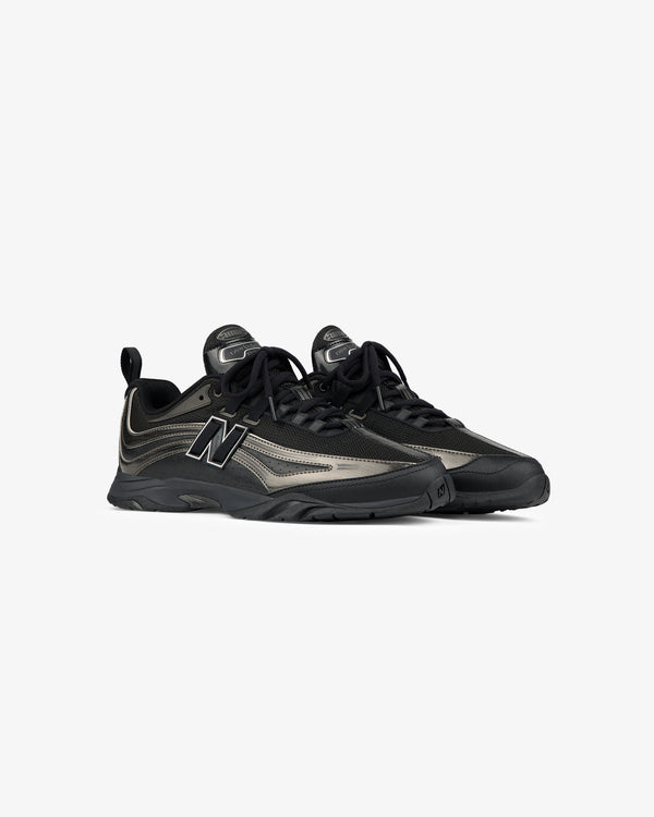 A pair of ALD / New Balance RC56 black and gray lace-up sneakers on a plain white background.