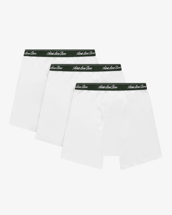 Boxer Brief 3-Pack: Three white pairs with black waistbands featuring white script text, arranged side by side.