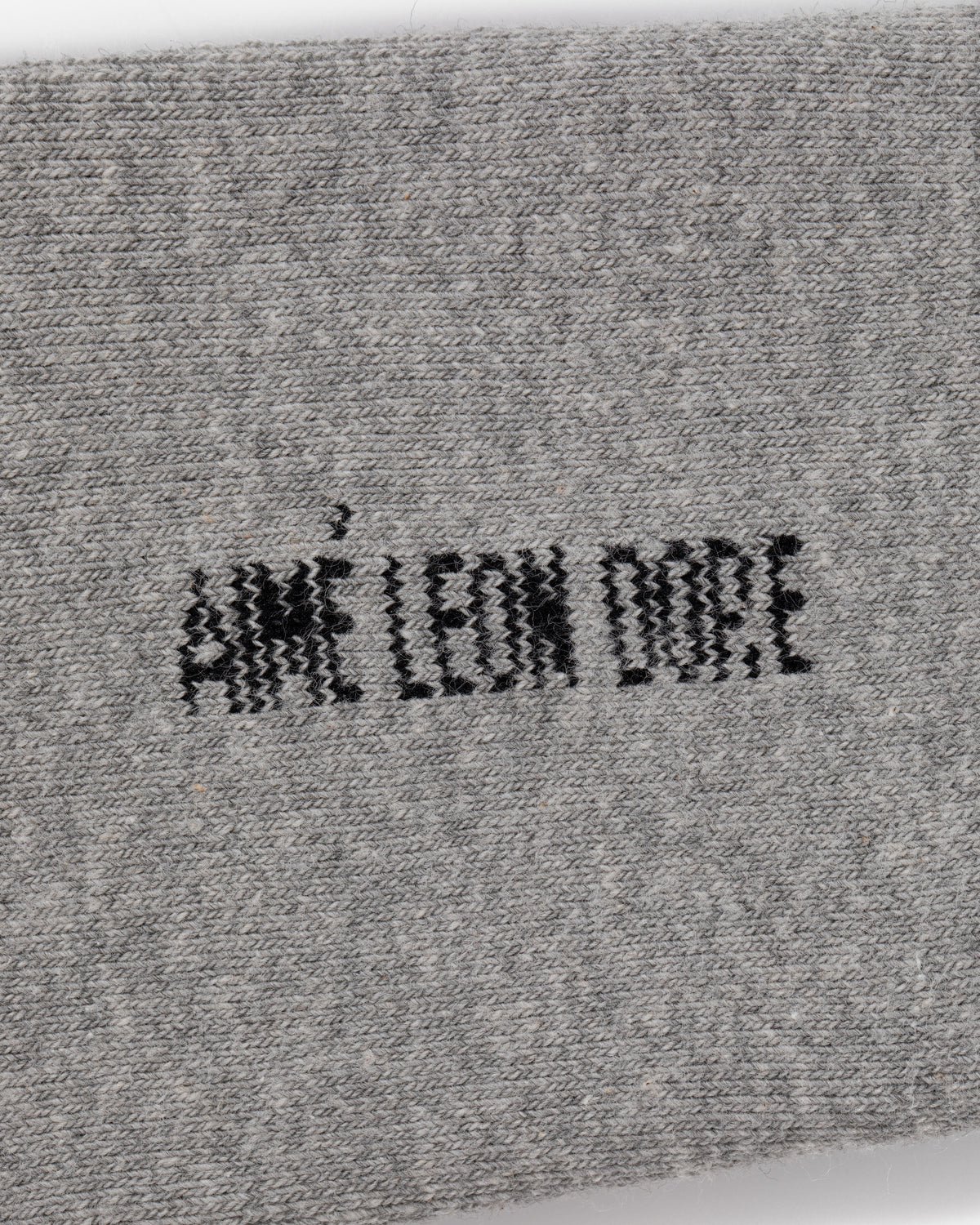 Gray fabric Crew Sock 3-Pack with AIMÉ LEON DORE embroidered in bold black capital letters at the center.
