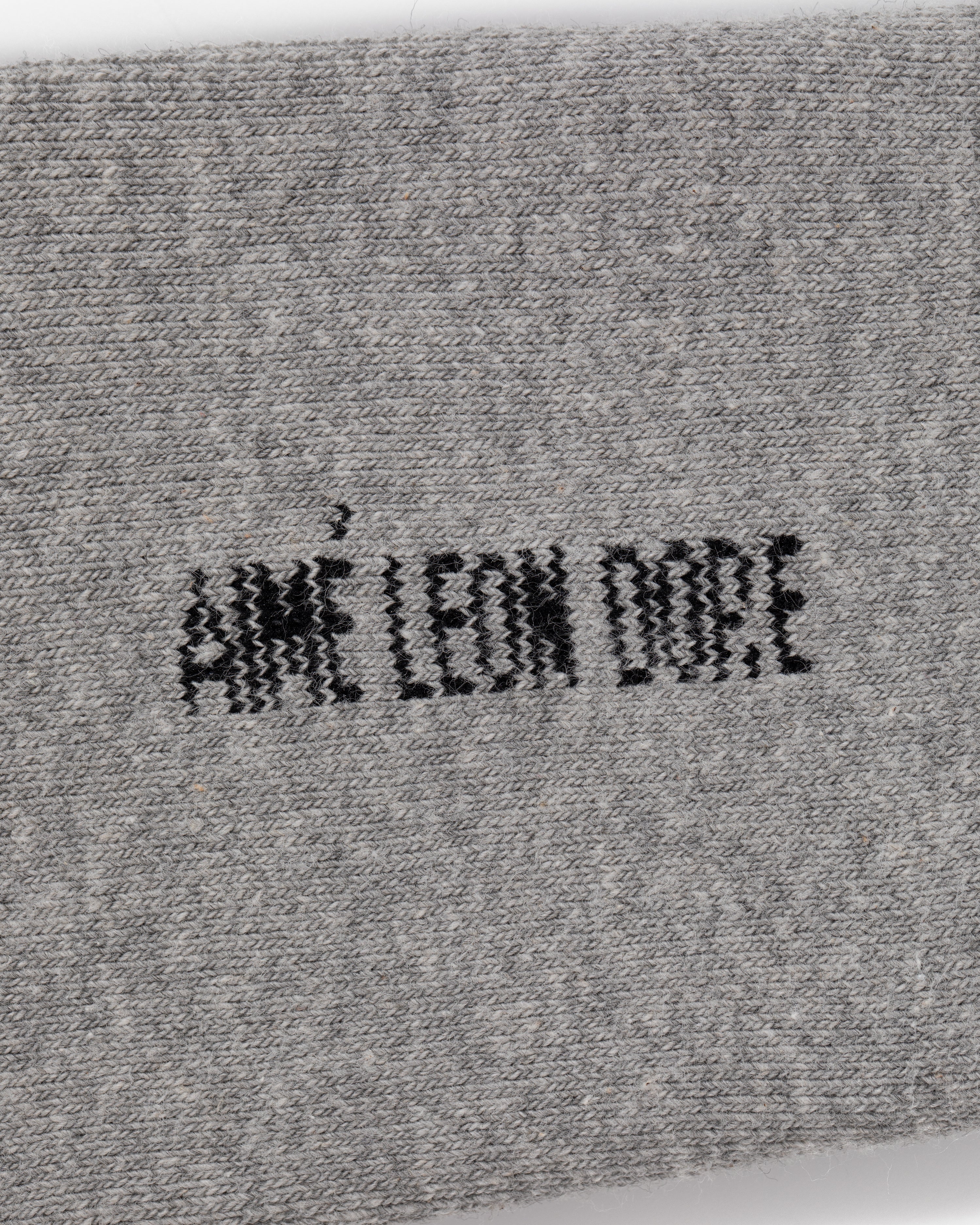 Gray fabric Crew Sock 3-Pack with AIMÉ LEON DORE embroidered in bold black capital letters at the center.