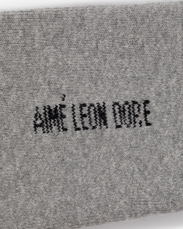 Gray fabric Crew Sock 3-Pack with AIMÉ LEON DORE embroidered in bold black capital letters at the center.
