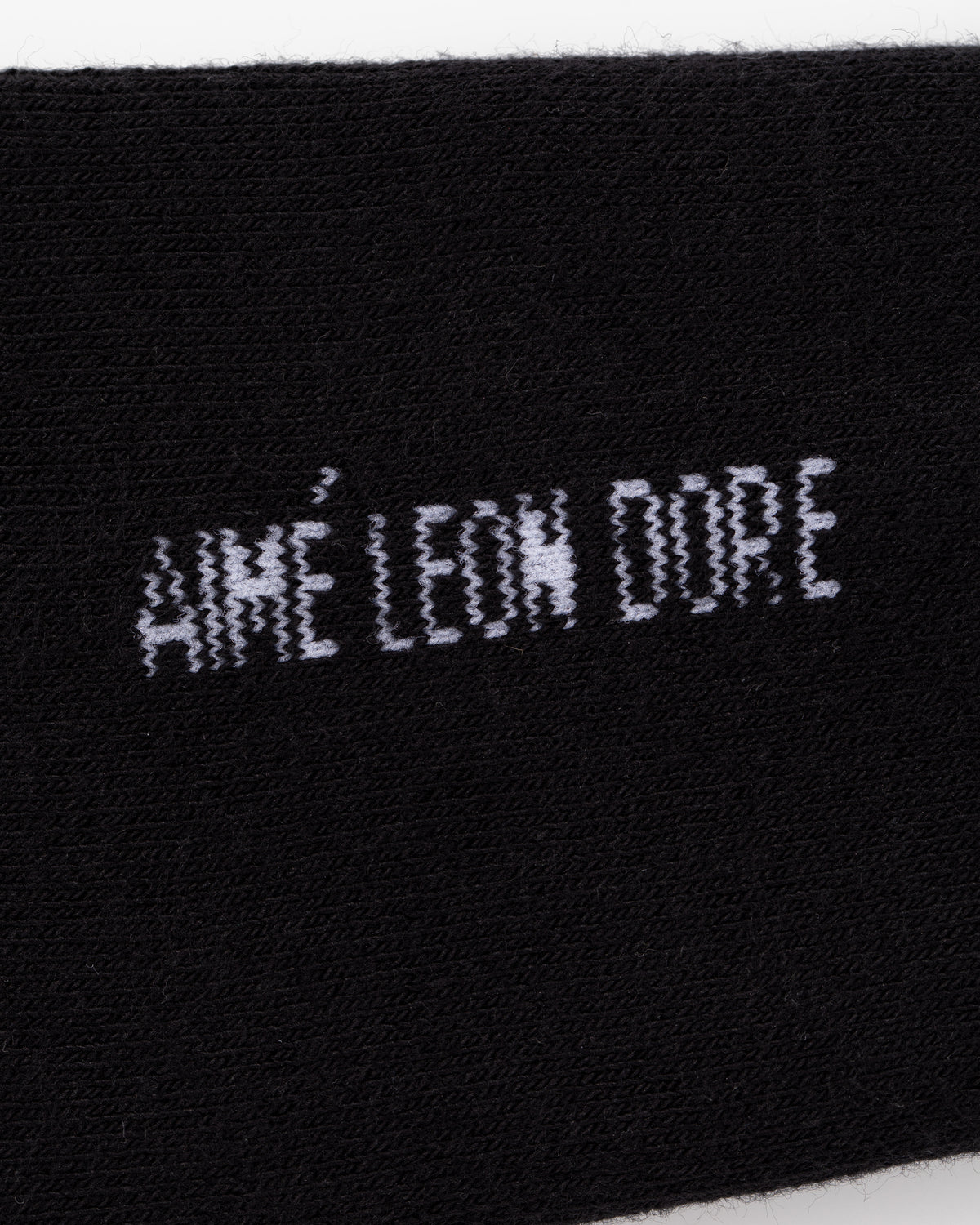 Black fabric Crew Sock 3-Pack with “AIMÉ LEON DORE” in a pixelated white stitched font.