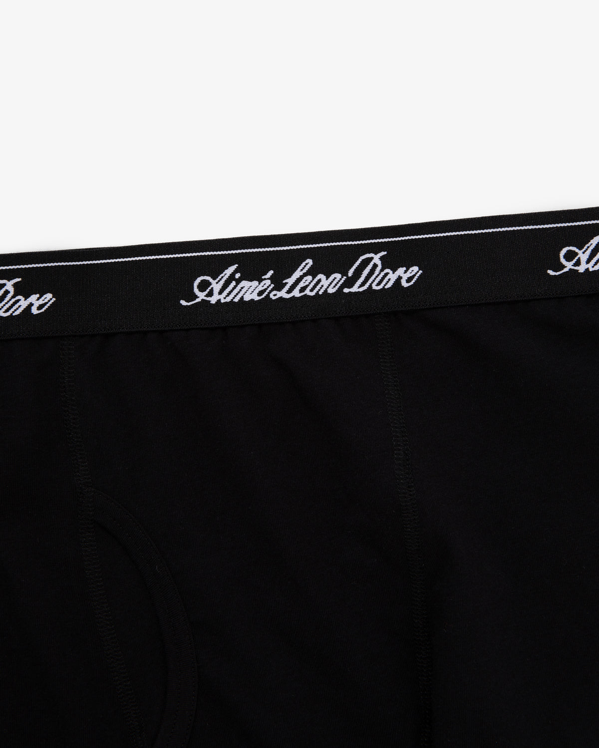 Close-up of black Boxer Brief 3-Pack with Aimé Leon Dore written in white script on the waistband.