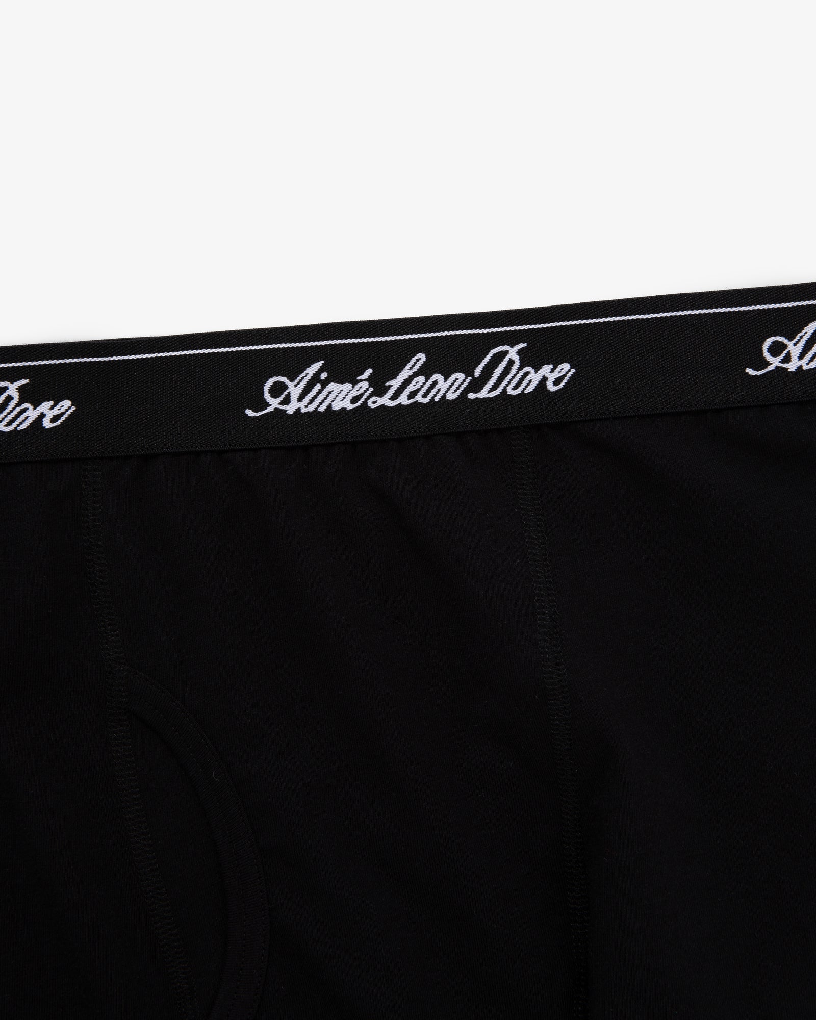 Close-up of black Boxer Brief 3-Pack with Aimé Leon Dore written in white script on the waistband.