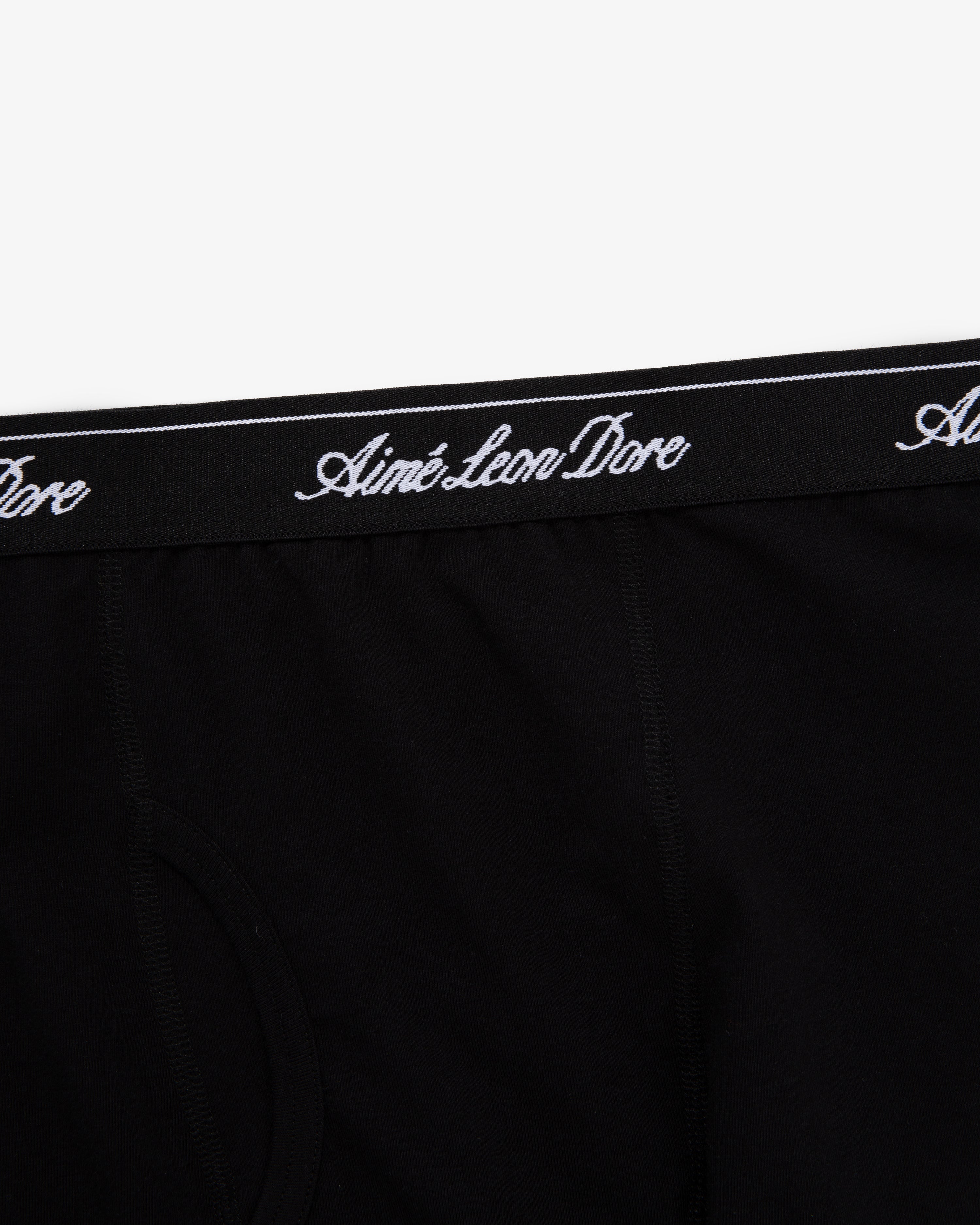 Close-up of black Boxer Brief 3-Pack with Aimé Leon Dore written in white script on the waistband.