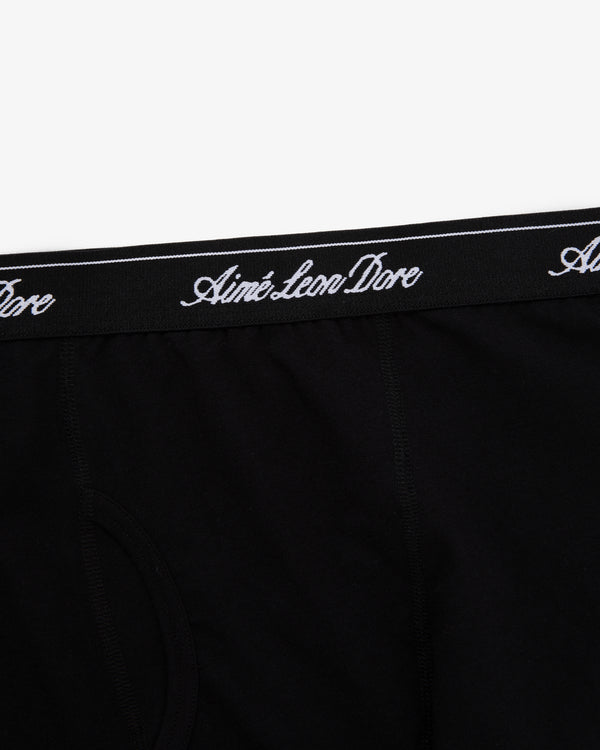 Close-up of black Boxer Brief 3-Pack with Aimé Leon Dore written in white script on the waistband.
