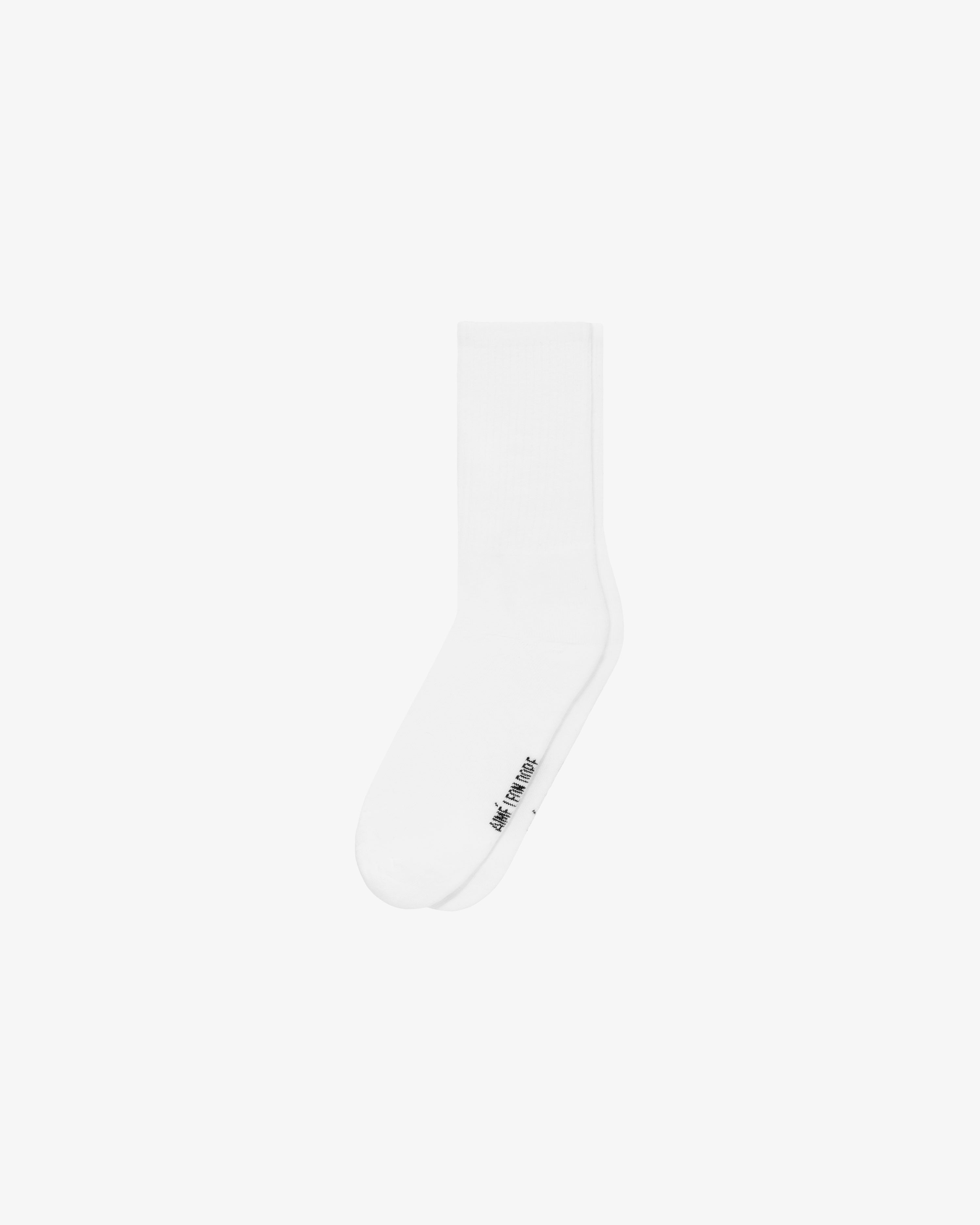 A Crew Sock 3-Pack in white with small black text near the toe, shown on a plain white background.