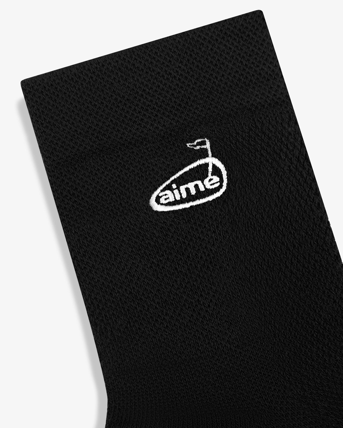 ALD Golf Performance Ankle Sock: Black with a white oval aime logo and a small flag icon above the text.