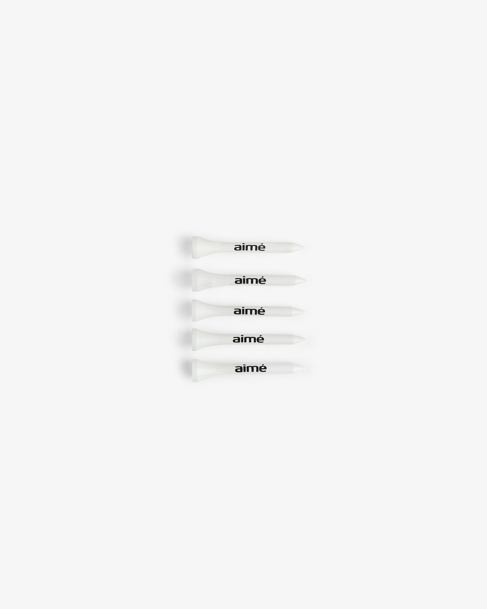 Fifty white ALD Golf Tees with "aimé" in black, arranged horizontally on a white background.