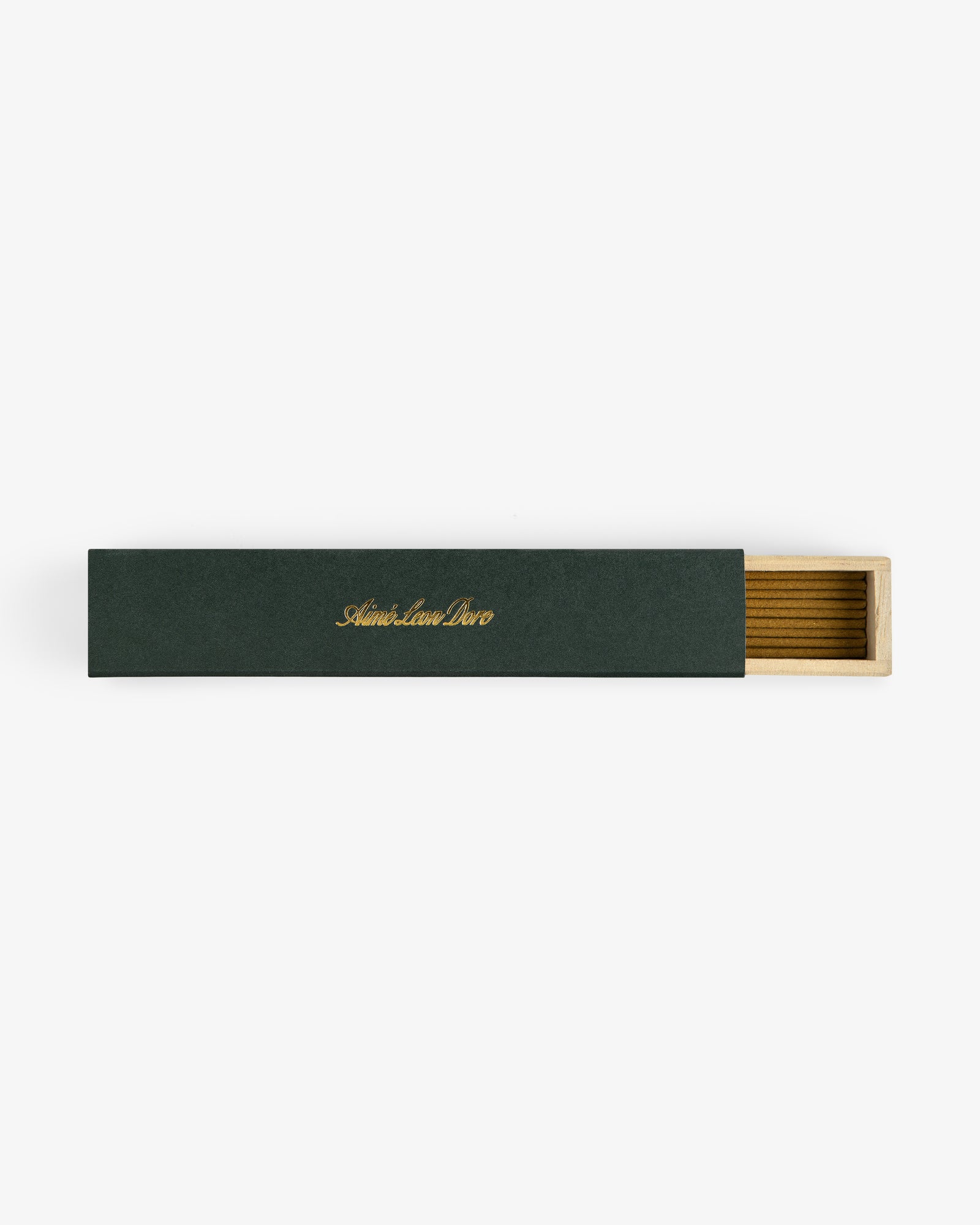 A rectangular green Mulberry Incense box with gold text, partially open to reveal a wooden interior.