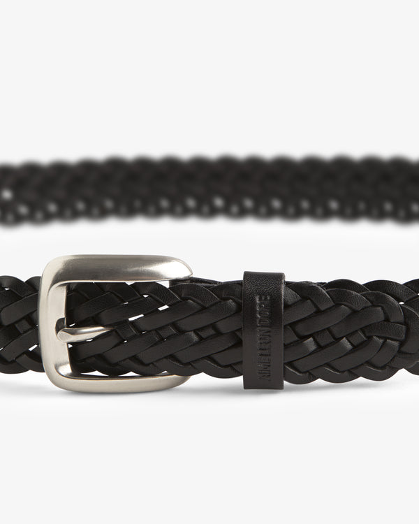 Close-up of the Braided Leather Belt in black with a silver buckle on a white background.