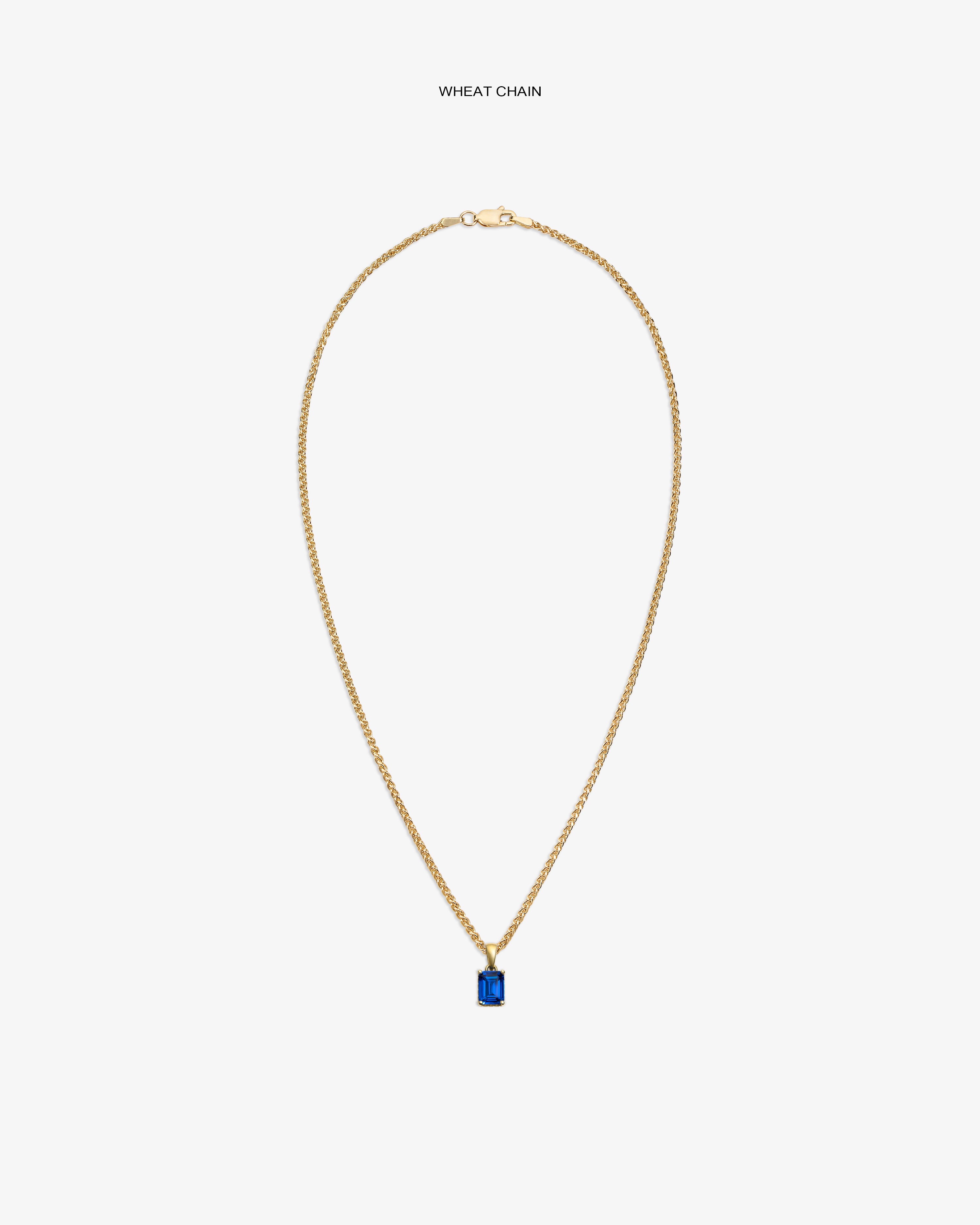 14Kt Gold Gemstone Pendant on a wheat chain, featuring a rectangular blue stone, shown on a white background.