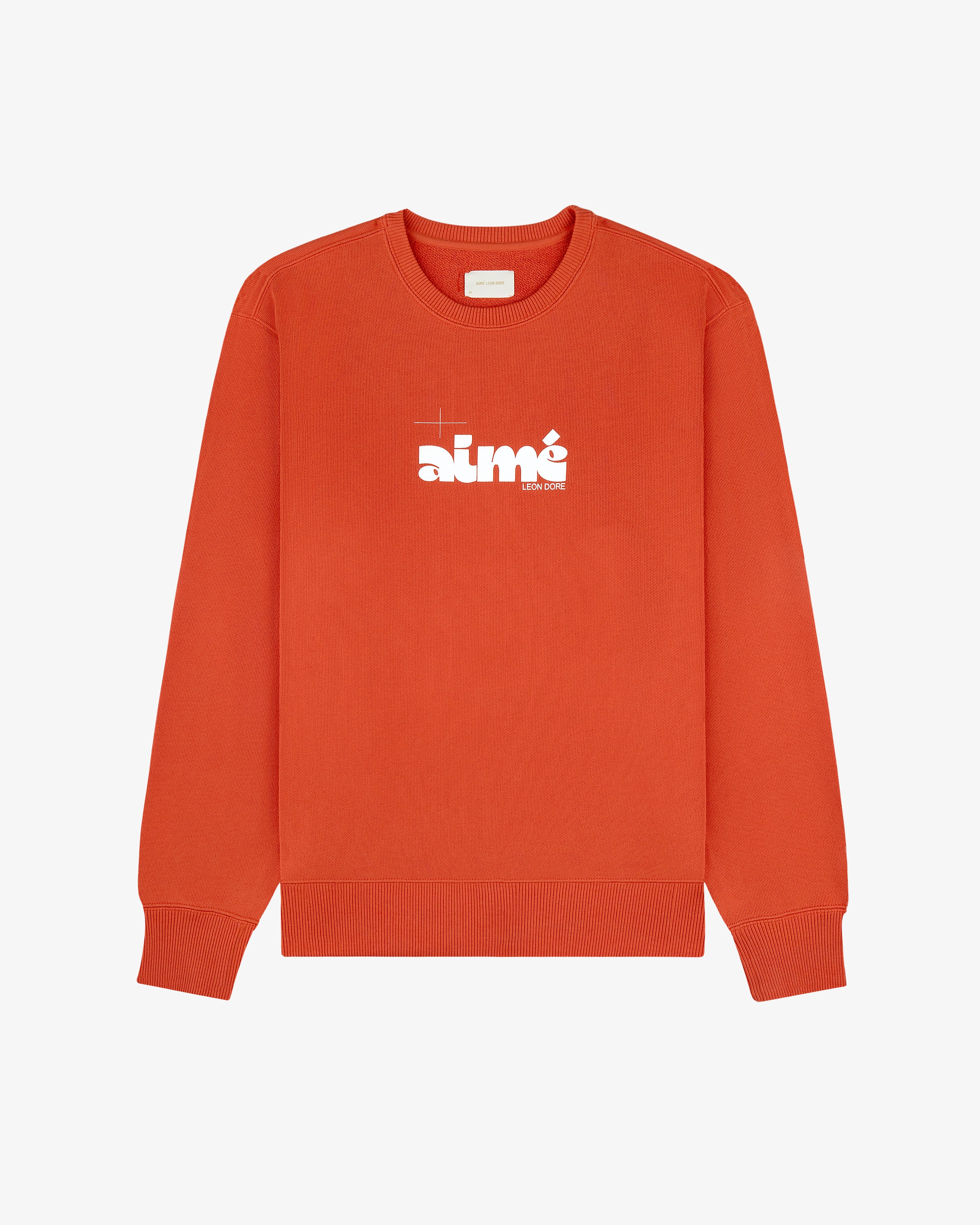 Drafting Logo Crewneck Sweatshirt in bright orange with “aimé” in bold white letters across the chest.