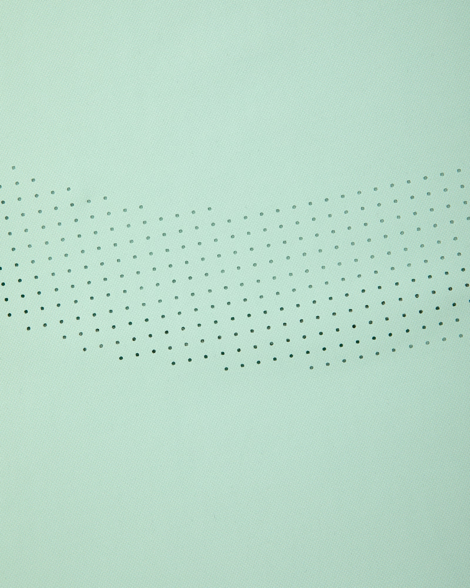 Aimé Performance Tank Top in light green with small black dots in a curved, fading pattern across the center.