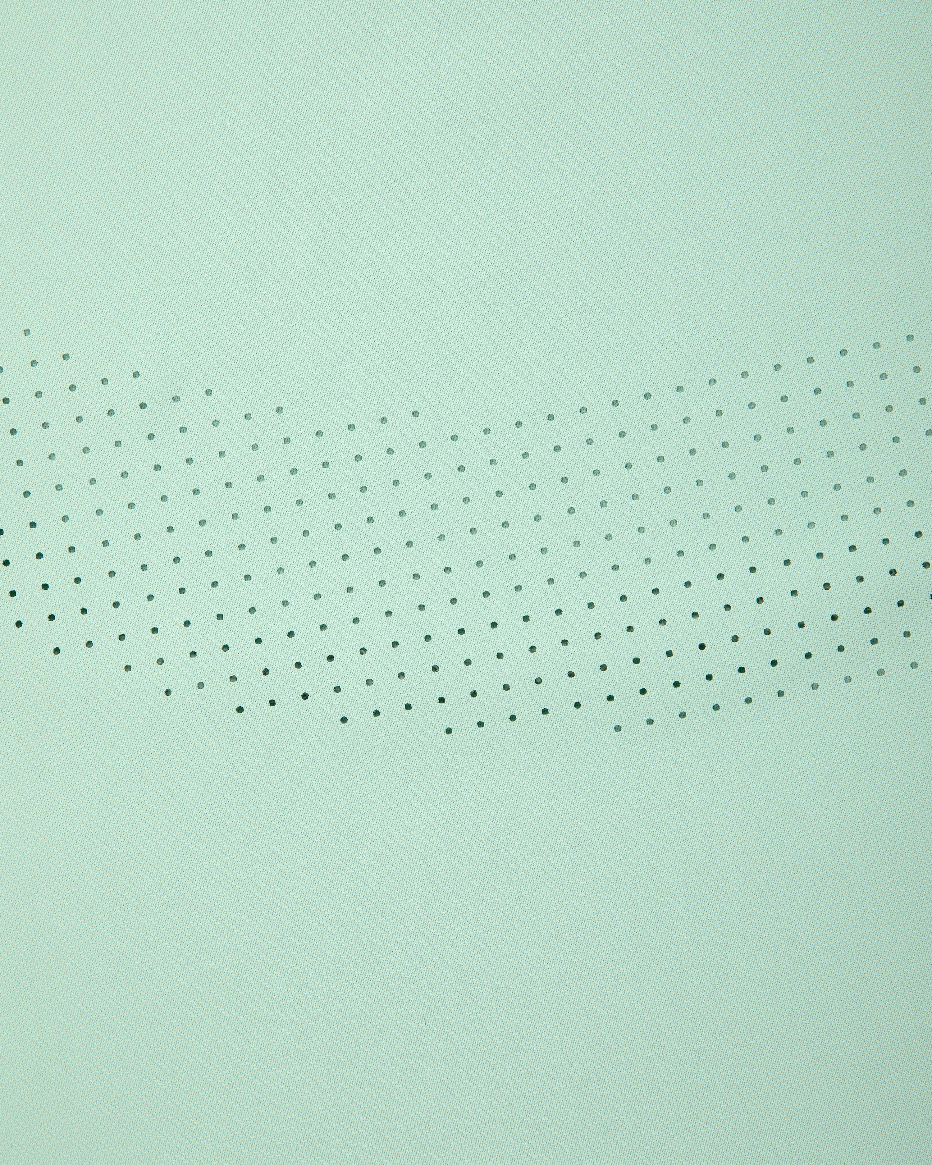 Aimé Performance Tank Top in light green with small black dots in a curved, fading pattern across the center.