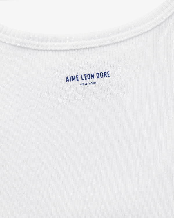 Close-up of the back neck area of the white Mets Tank Top with AIMÉ LEON DORE NEW YORK printed in blue text.