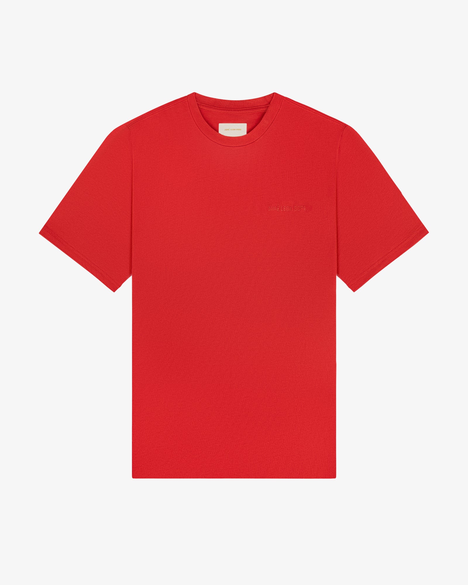 Tonal Logo Tee in bright red, short sleeves, small chest logo, shown flat on a white background.