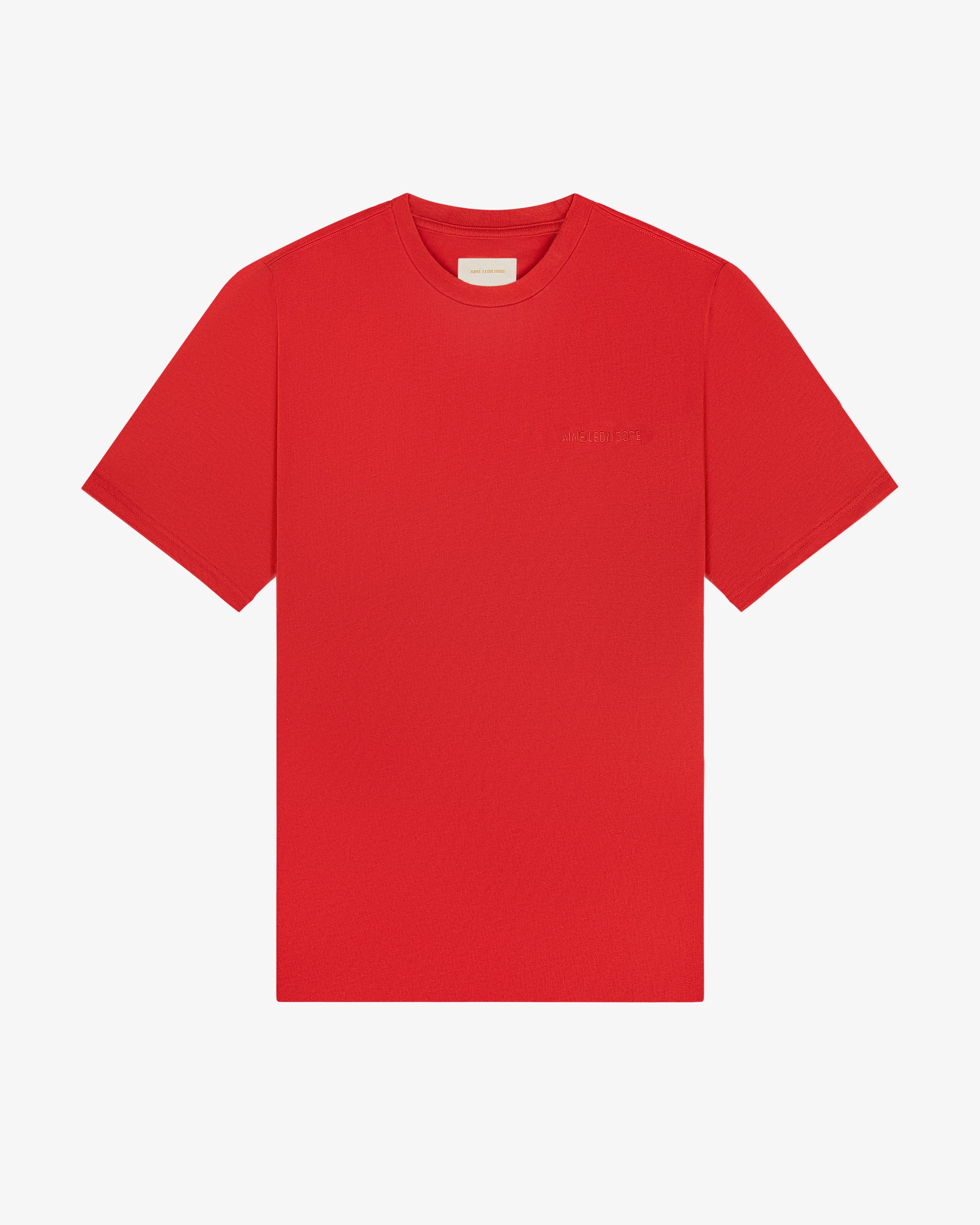 Tonal Logo Tee in bright red, short sleeves, small chest logo, shown flat on a white background.