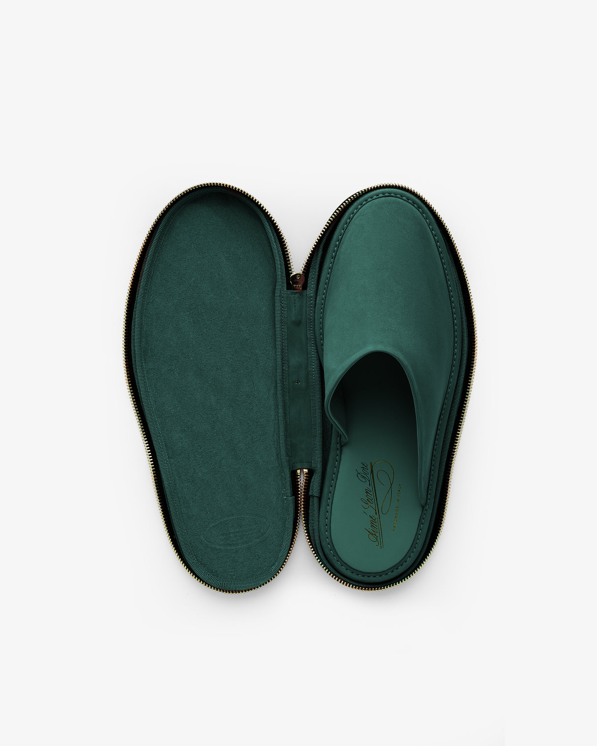 A single Nubuck Travel Slipper in green, placed inside an oval, zippered case matching its shape and color.
