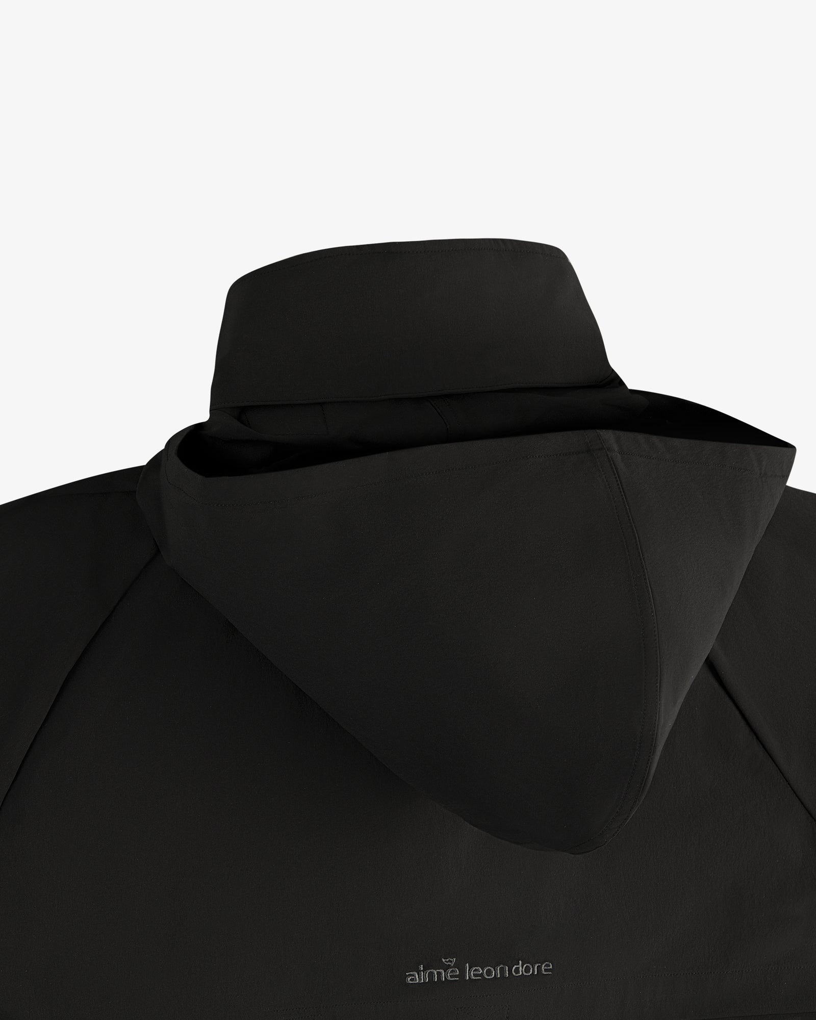 ALD Golf Cordura Tips Jacket in black, back view with hood and aime leon dore logo near the collar.