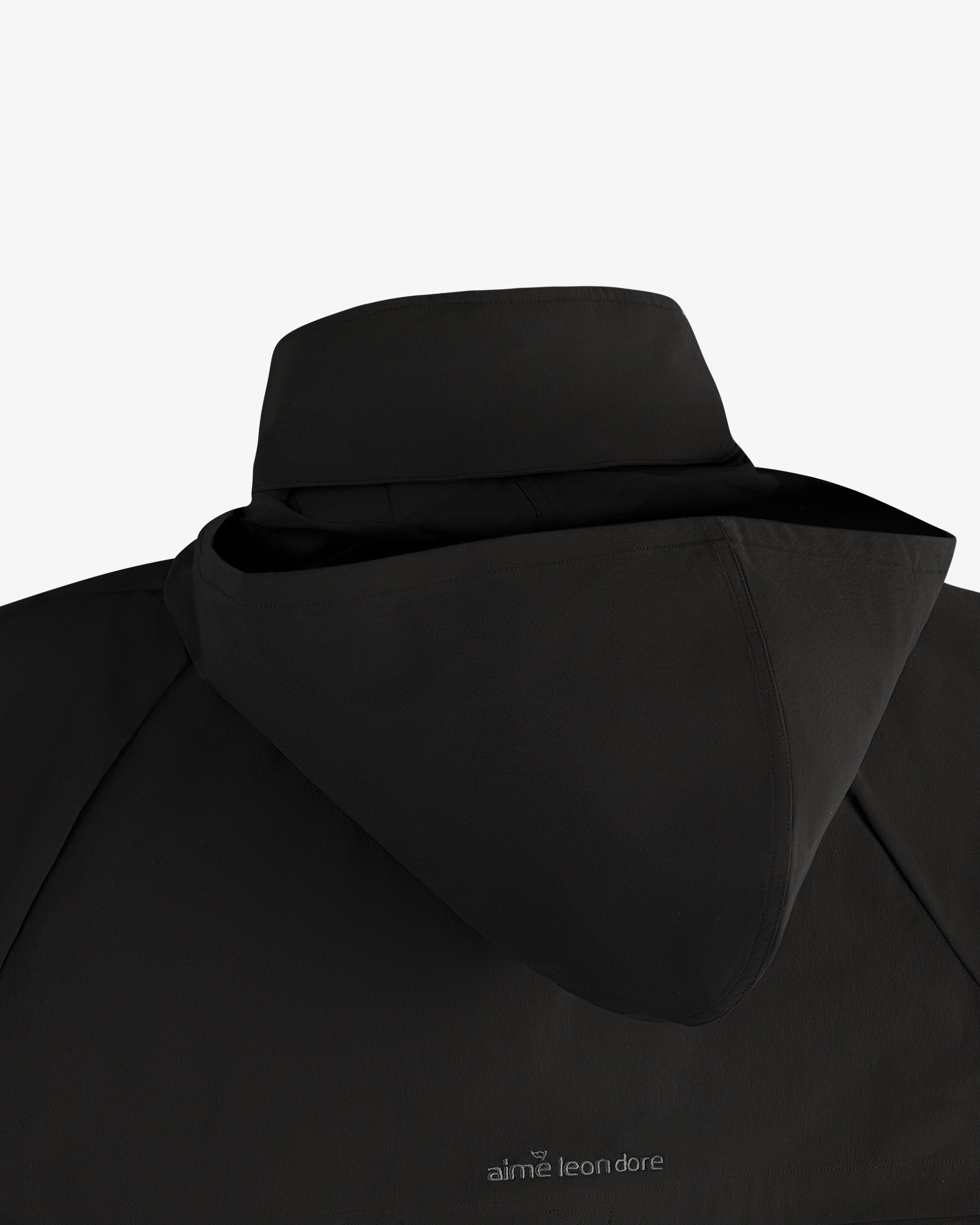 ALD Golf Cordura Tips Jacket in black, back view with hood and aime leon dore logo near the collar.