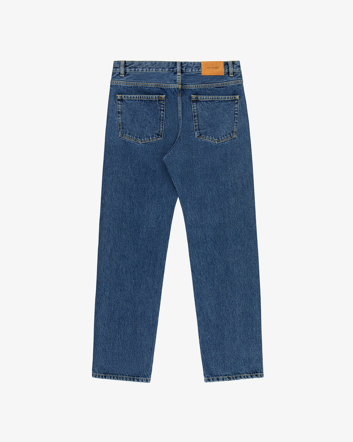 Back view of ALD Straight Fit Denim in blue with two rear pockets and a tan leather waistband patch.